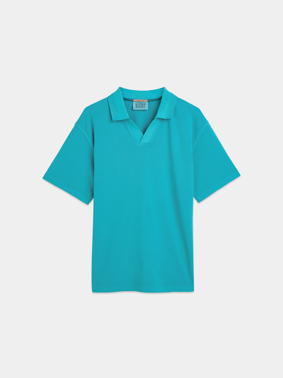 Navy Scotch & Soda pique polo shirt with a classic collar and short sleeves, displayed on a model.