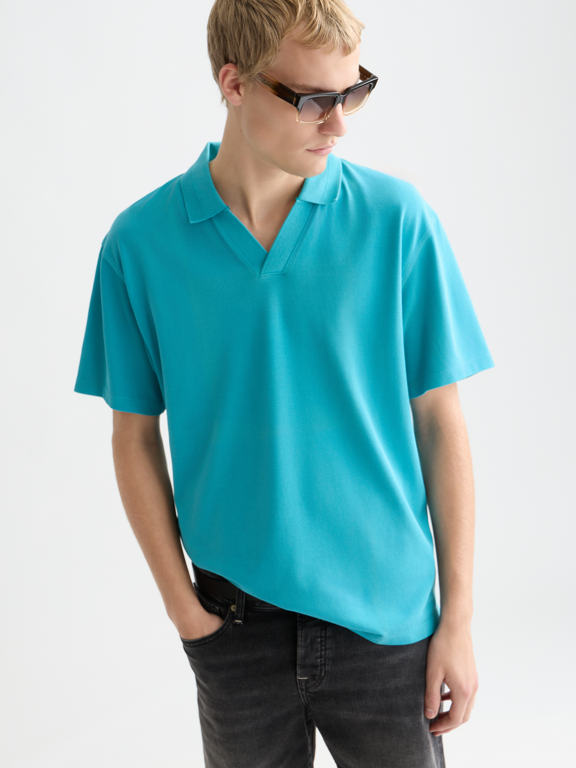 Navy SCOTCH & SODA pique polo shirt with a classic collar and short sleeves, displayed flat on a white background.