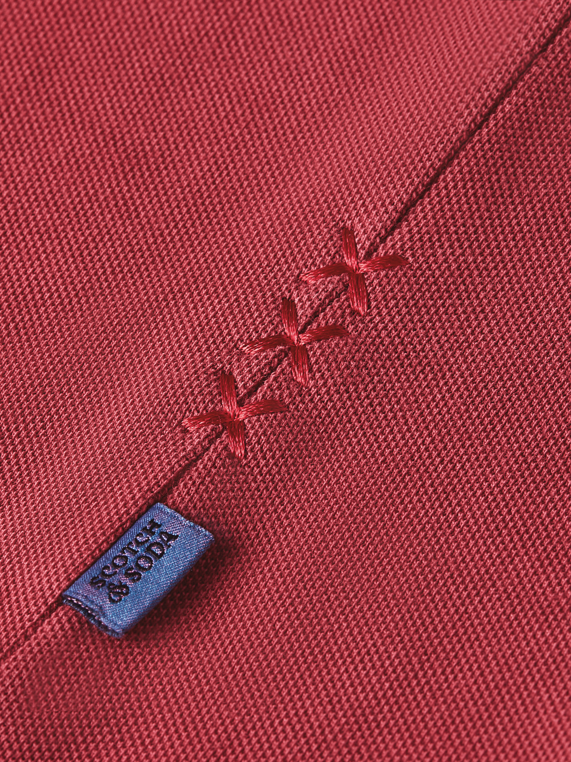 Men's navy blue Scotch & Soda pique polo shirt with a classic collar and short sleeves, shown flat on a white background.