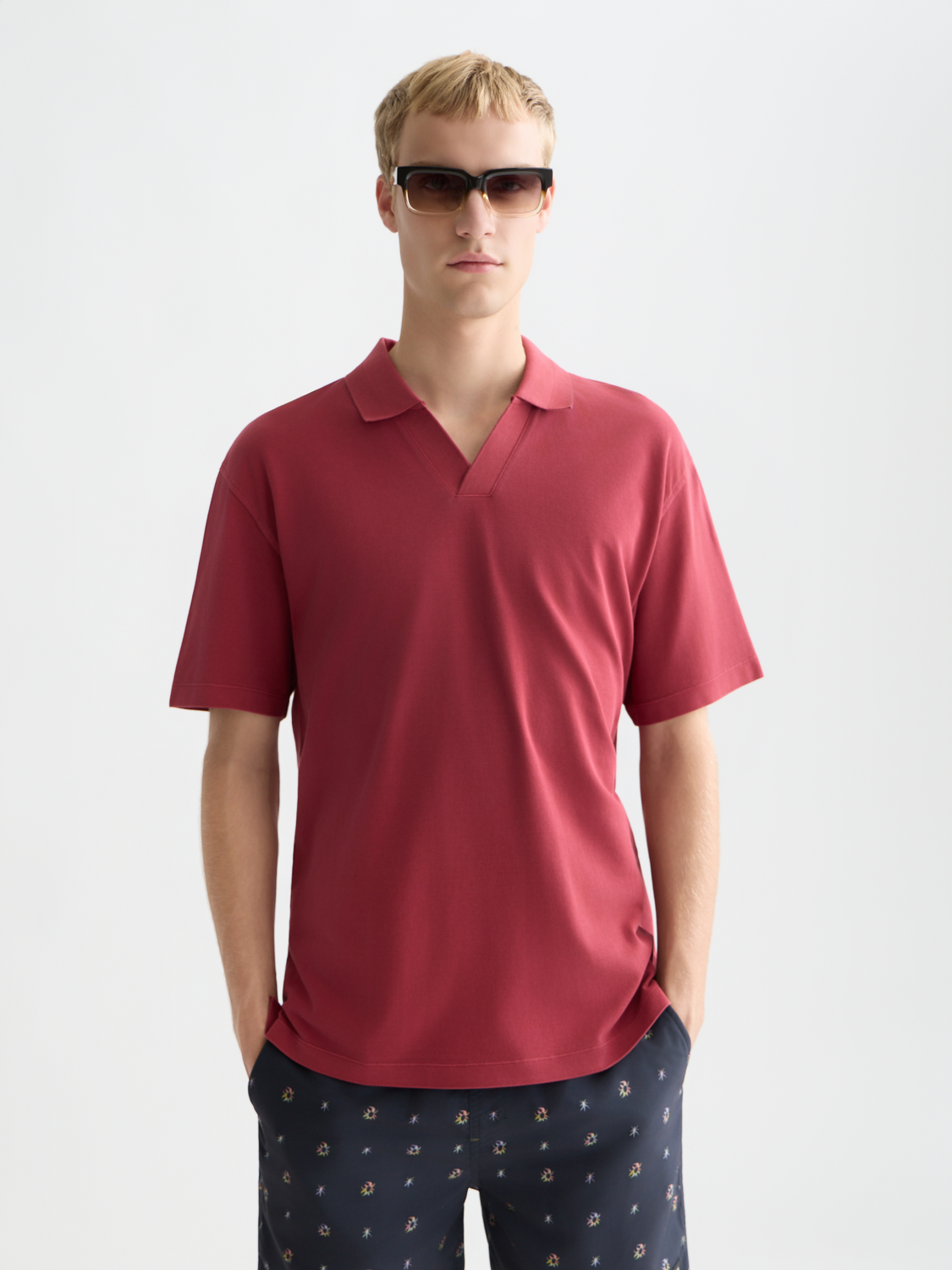 Light blue Scotch & Soda pique polo shirt with a classic collar and short sleeves, displayed flat.