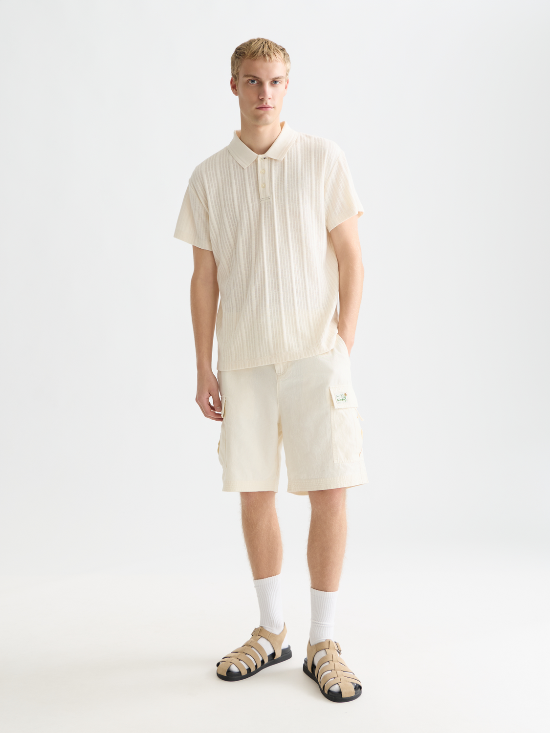 Scarlet red Scotch & Soda ribbed polo shirt with a classic collar and short sleeves, displayed on a white background.