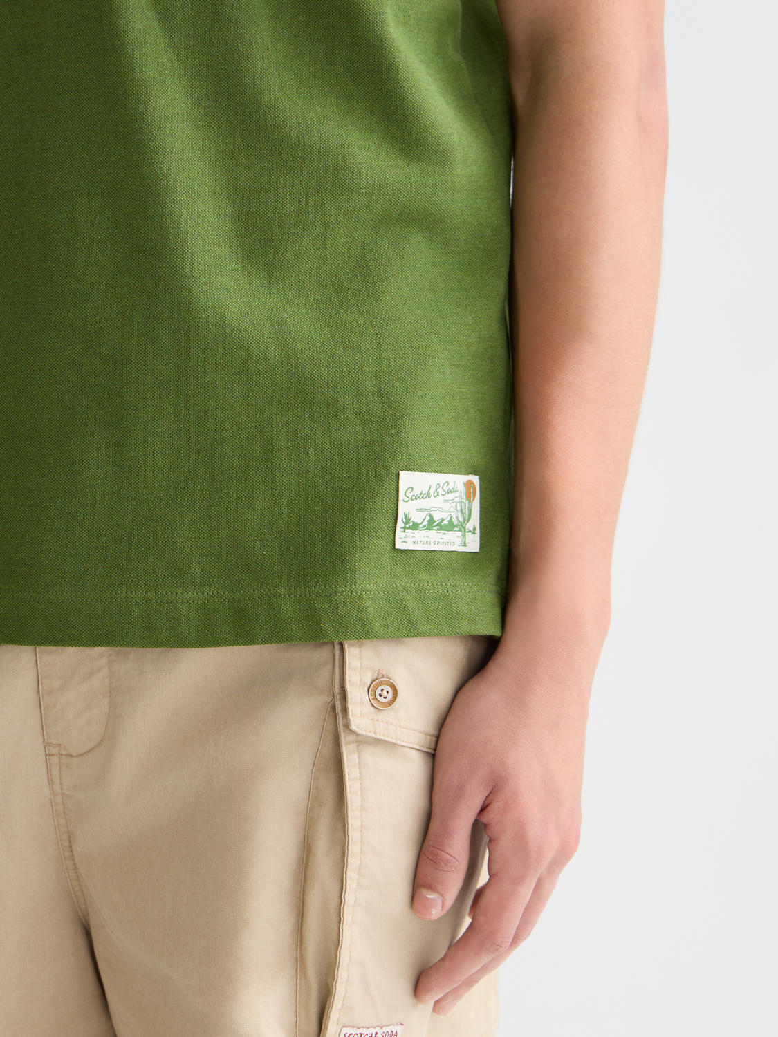 Scotch & Soda melange polo shirt in navy with a classic collar and short sleeves, displayed on a plain background.