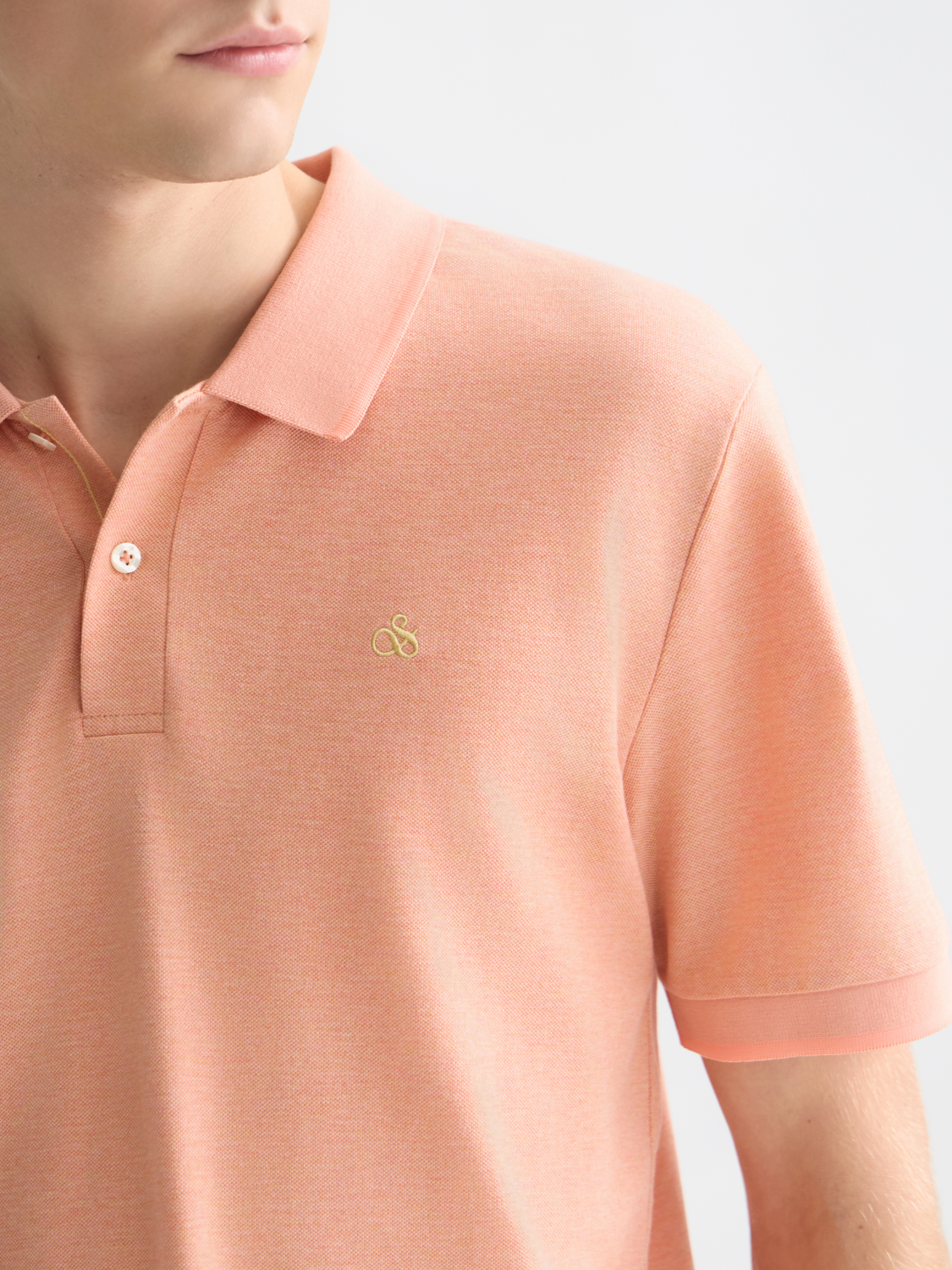 Scotch & Soda Melange polo shirt in navy with a classic collar and short sleeves, displayed flat on a neutral background.
