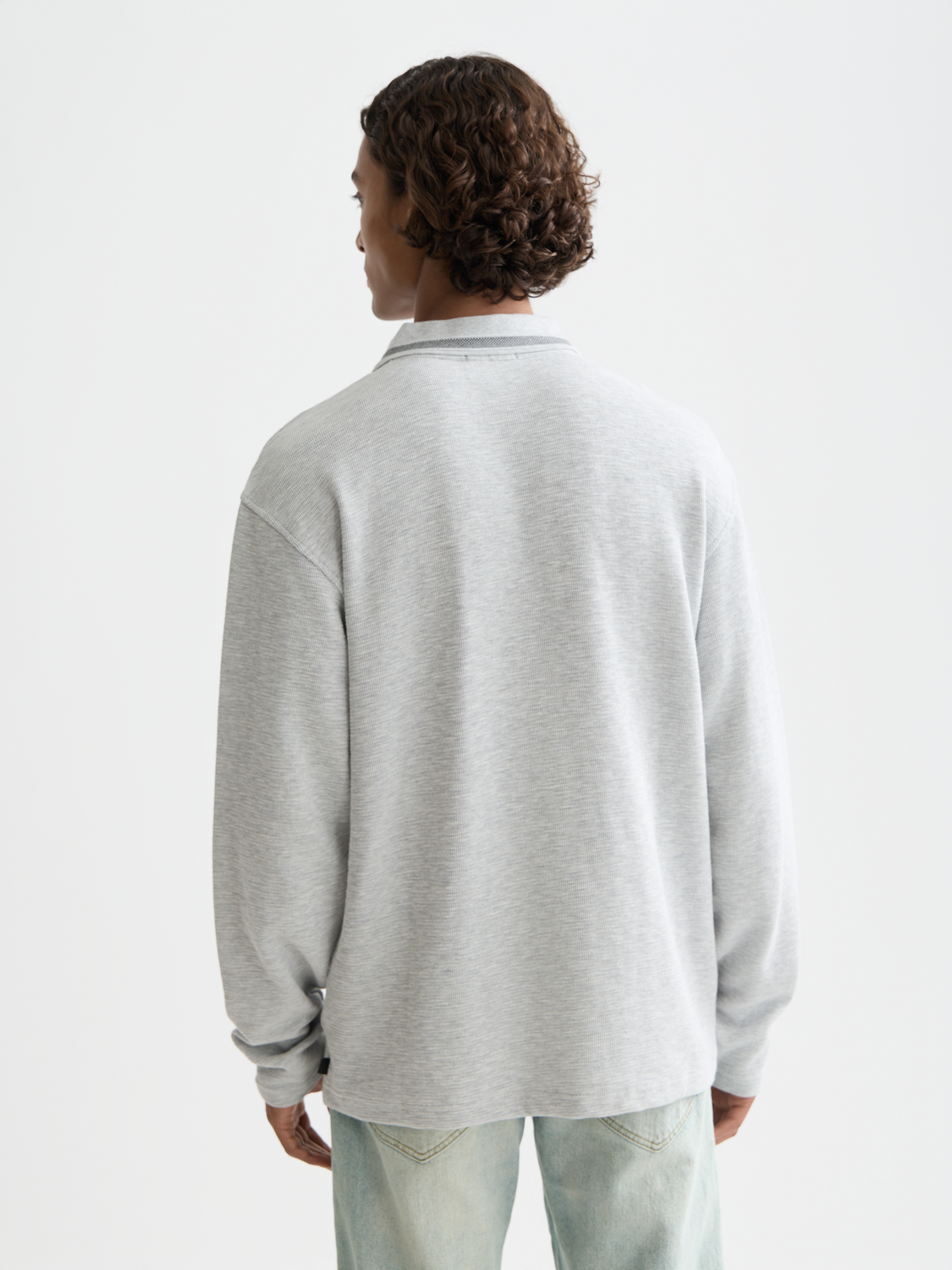 Long-sleeved polo shirt by Scotch & Soda, shown from the back in navy blue with a classic collar and buttoned placket.