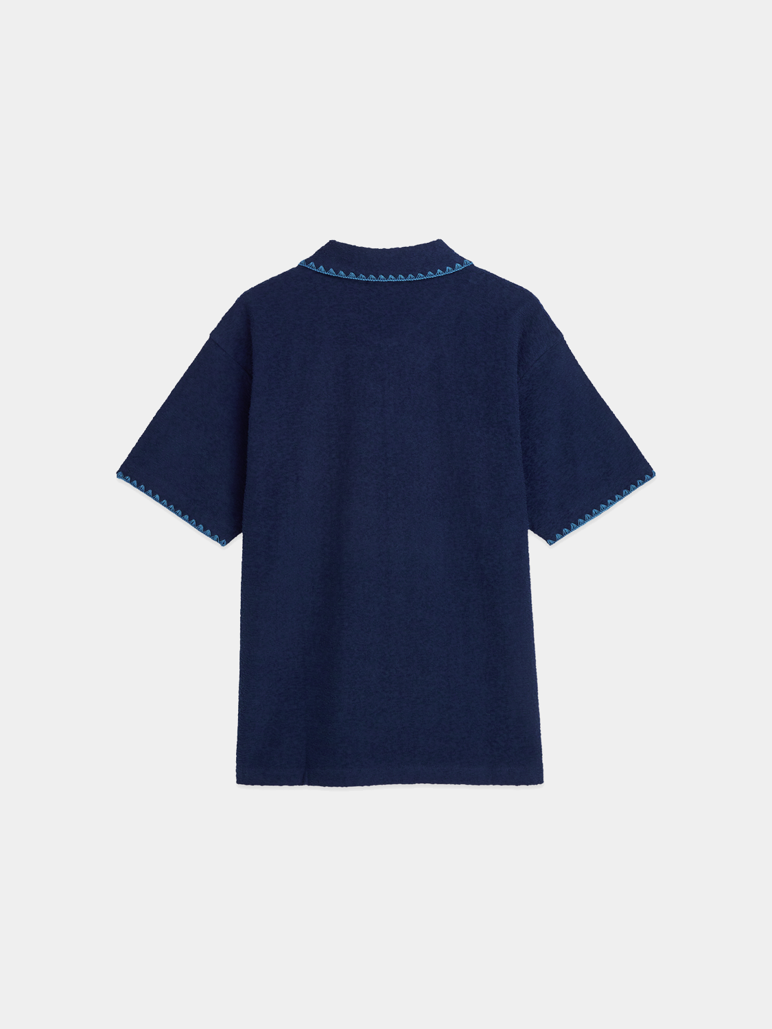 Black Scotch & Soda jacquard towelling polo shirt displaying textured fabric and classic polo collar.