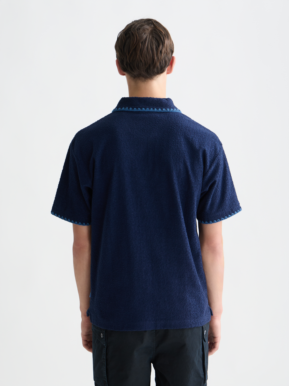 SCOTCH & SODA jacquard towelling polo shirt, back view showing textured fabric and classic polo collar.