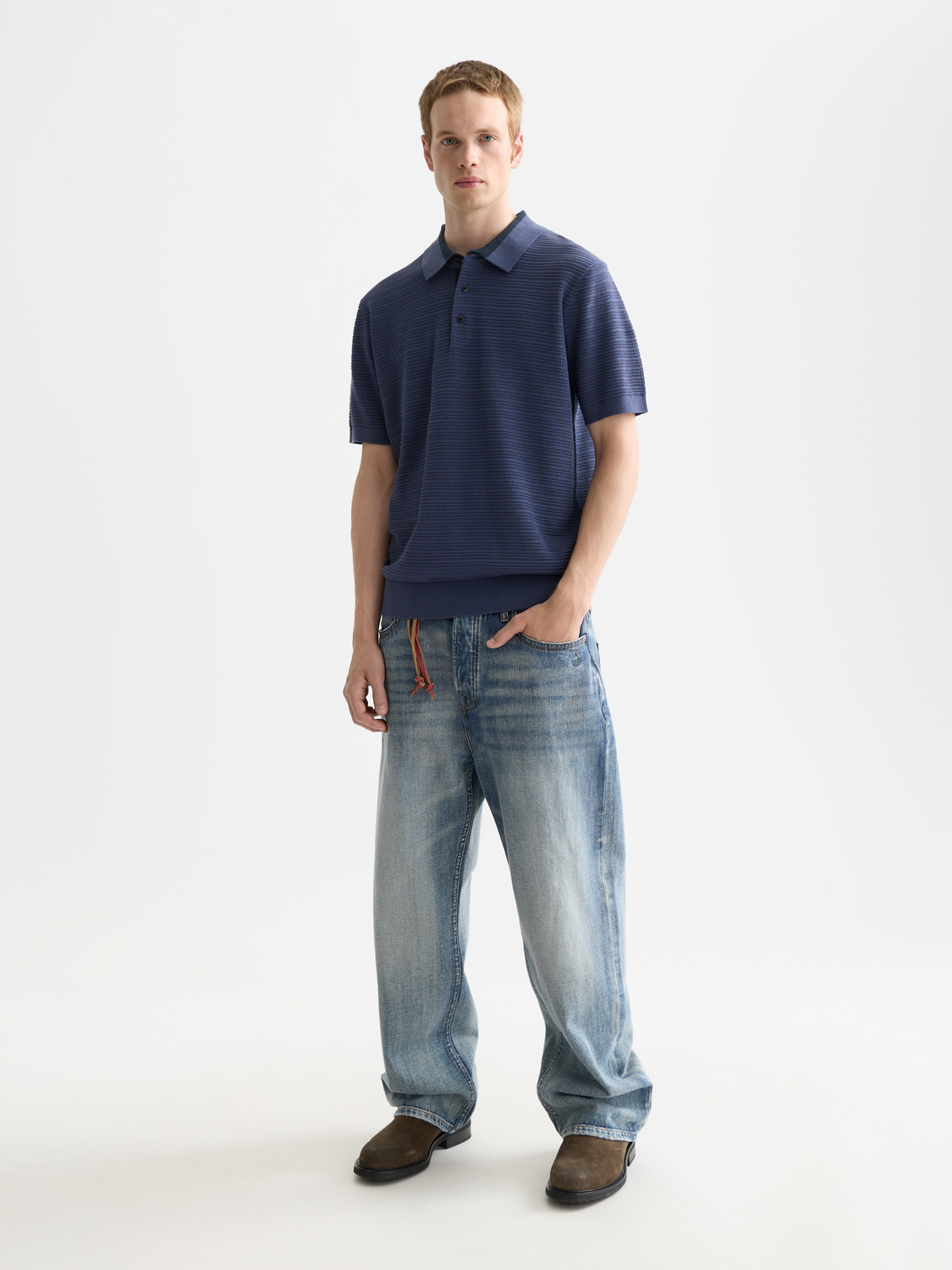 Structured knit polo shirt by Scotch & Soda featuring a classic collar and textured knit fabric for a stylish, casual look.