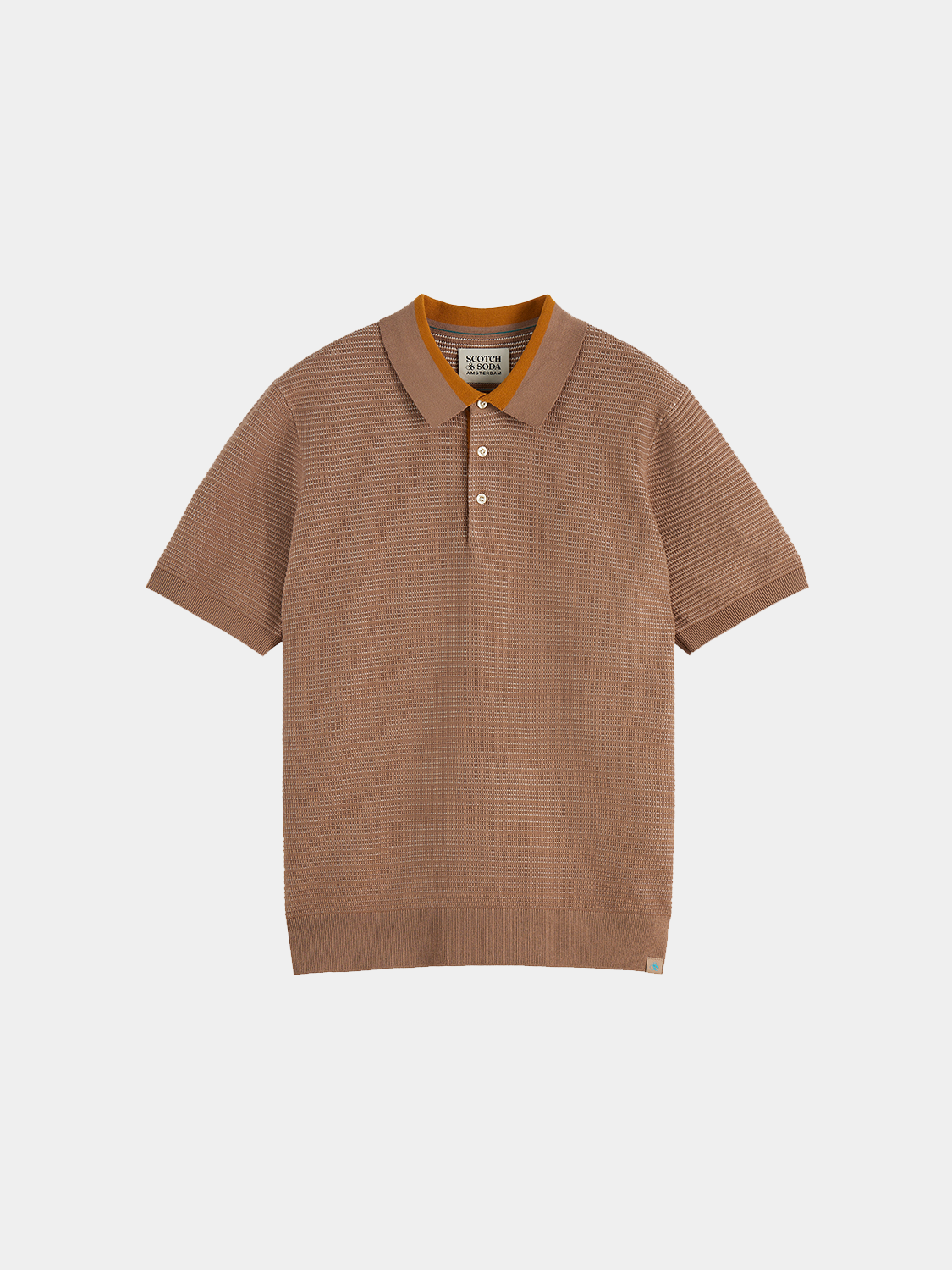 Structured knit polo shirt by Scotch & Soda featuring a classic collar and textured knit fabric, shown in a front view.