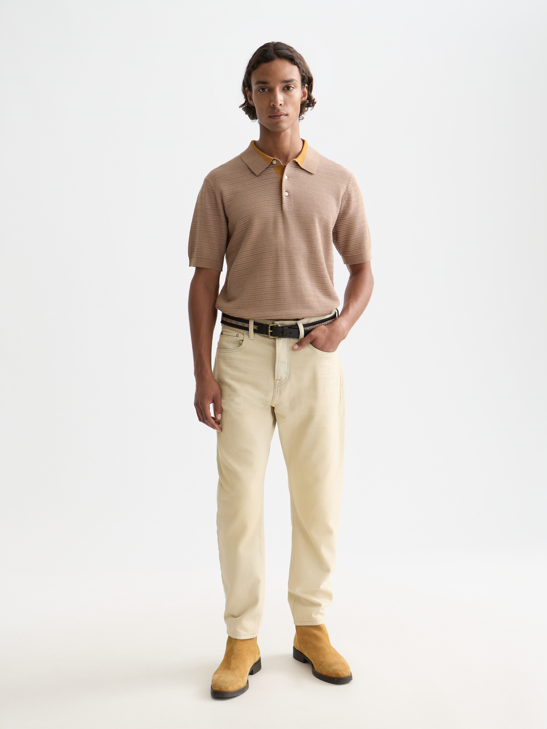 Structured knit polo shirt by Scotch & Soda featuring a classic collar and textured knit fabric, front view.