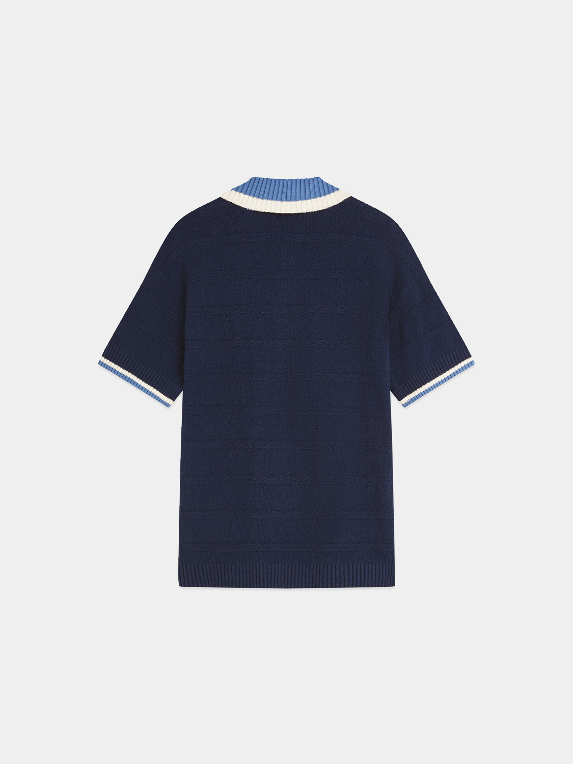 Black knitted polo shirt from Scotch & Soda, featuring a classic collar and textured knit fabric.