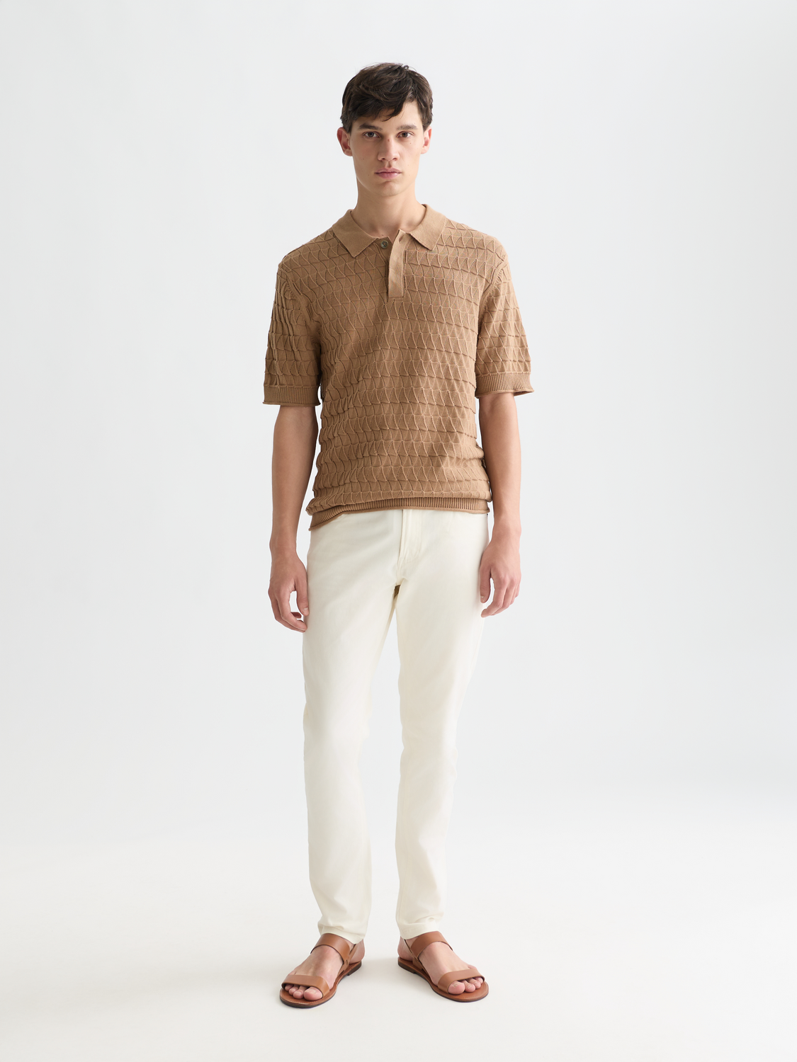 Scotch & Soda knitted polo shirt with a classic collar and short sleeves, featuring a textured knit pattern.