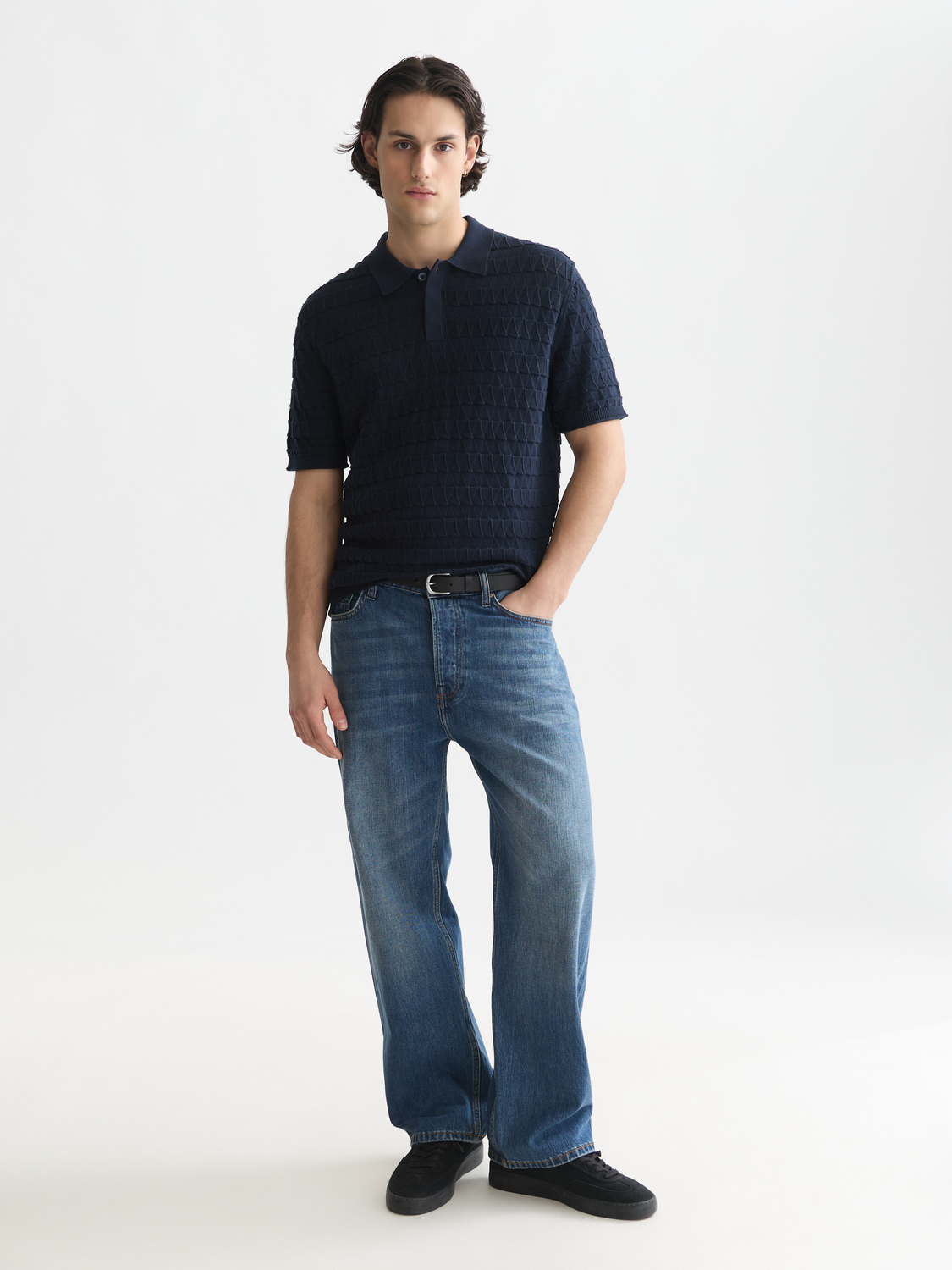 Knitted polo shirt by Scotch & Soda in navy, featuring a classic collar and textured knit fabric.