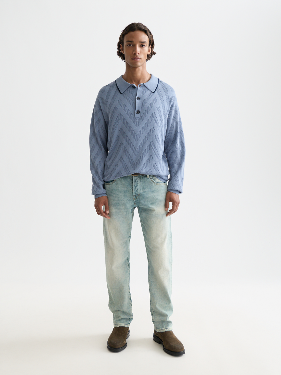 Long-sleeved Scotch & Soda polo shirt in navy with a classic collar and button placket, shown on a model.