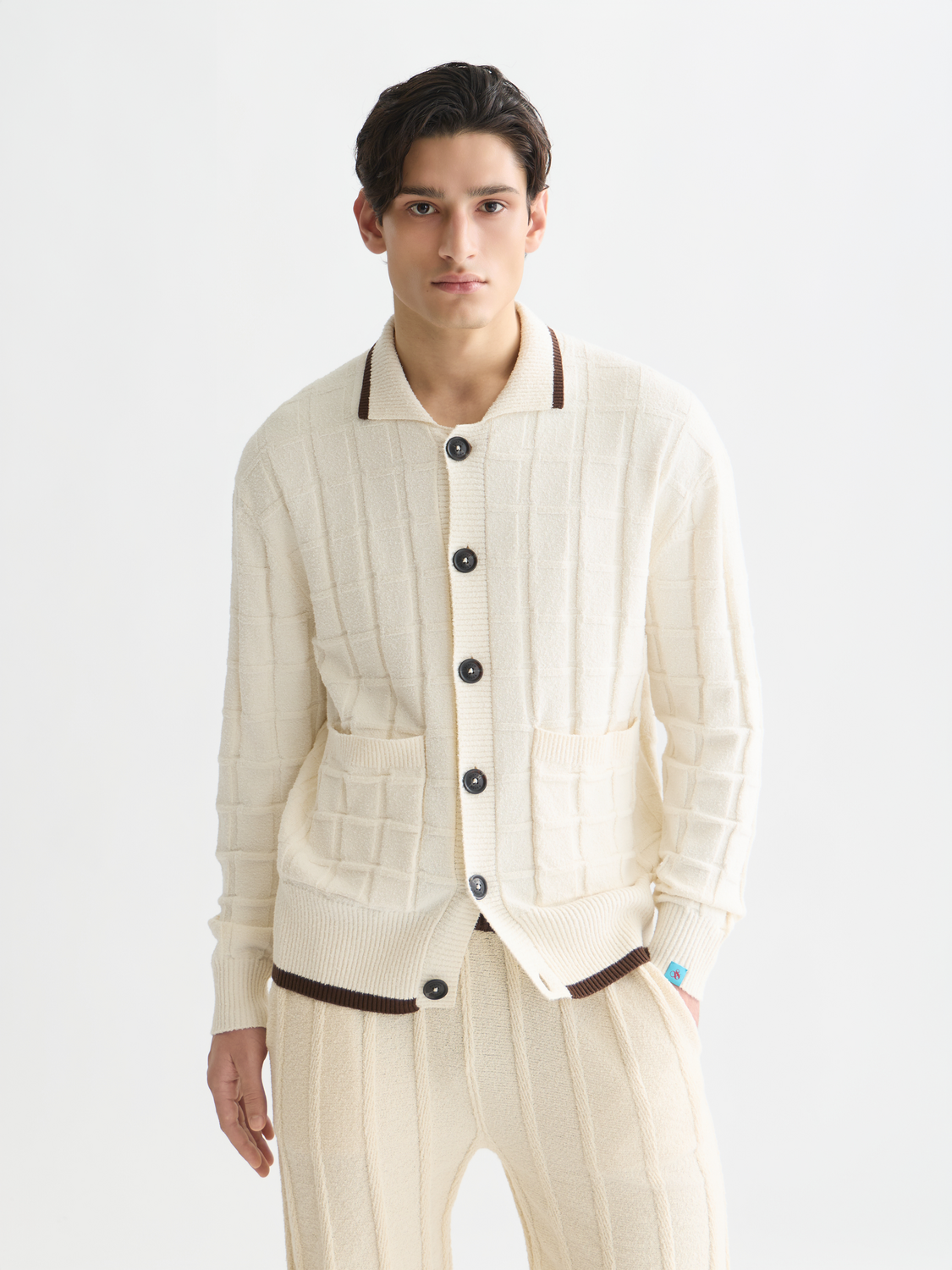 Structured boucle cardigan from Scotch & Soda, featuring a textured knit design and a classic button-up front.