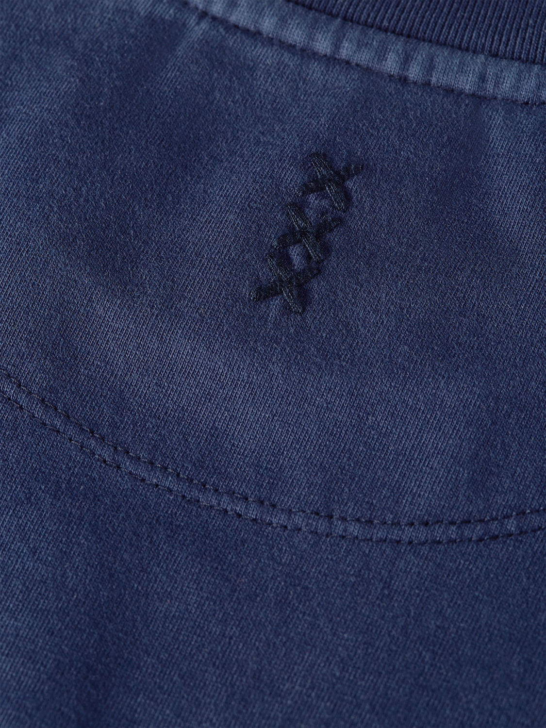 Soft garment-dyed Scotch & Soda short sleeve T-shirt displayed flat in a natural fabric tone.