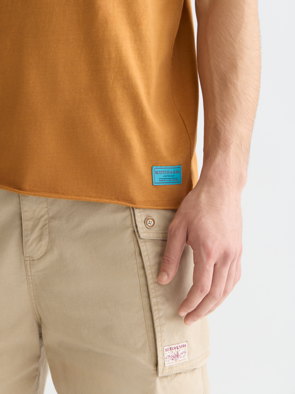 Raw edge Scotch & Soda short sleeve t-shirt with a relaxed fit, shown in natural fabric detail and casual style.