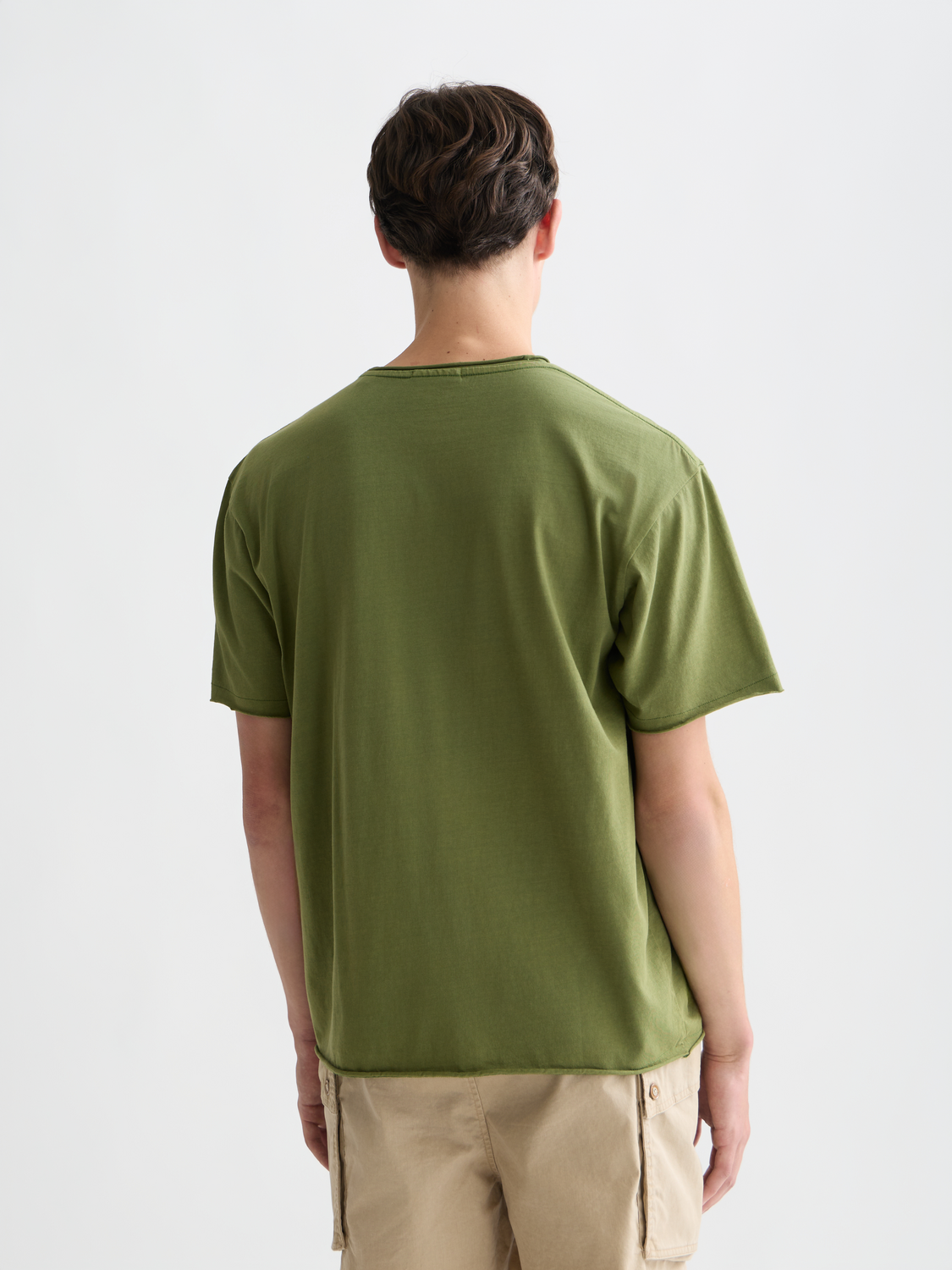 Raw edge Scotch & Soda short sleeve t-shirt displayed from the back with a relaxed fit and casual style.