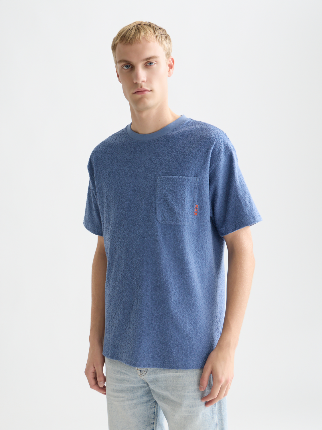 Jacquard towelling Scotch & Soda short-sleeve T-shirt with a textured pattern, front view on a model.