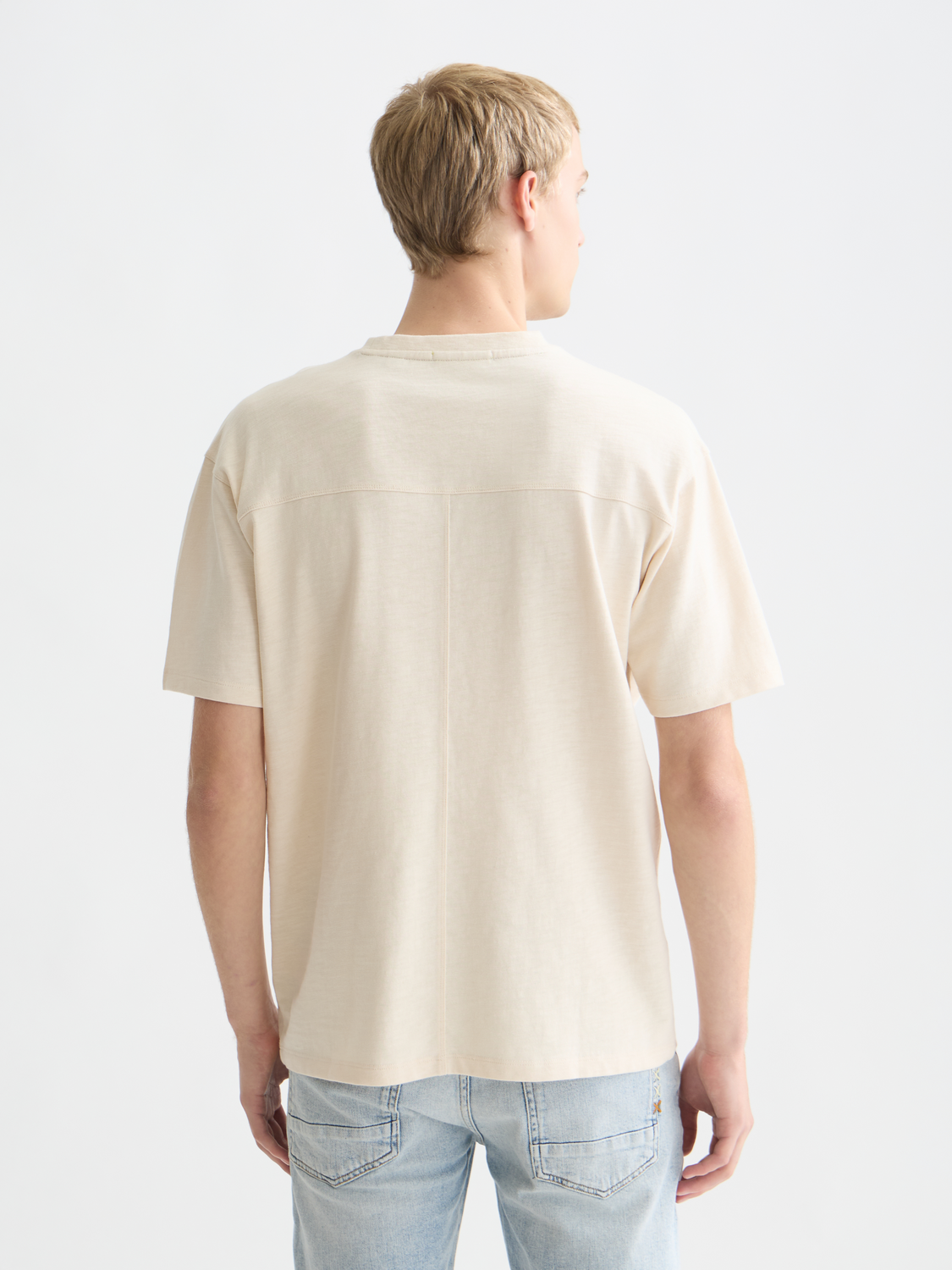 Short sleeve Scotch & Soda t-shirt with embroidered logo on front, shown from the back in the product image.