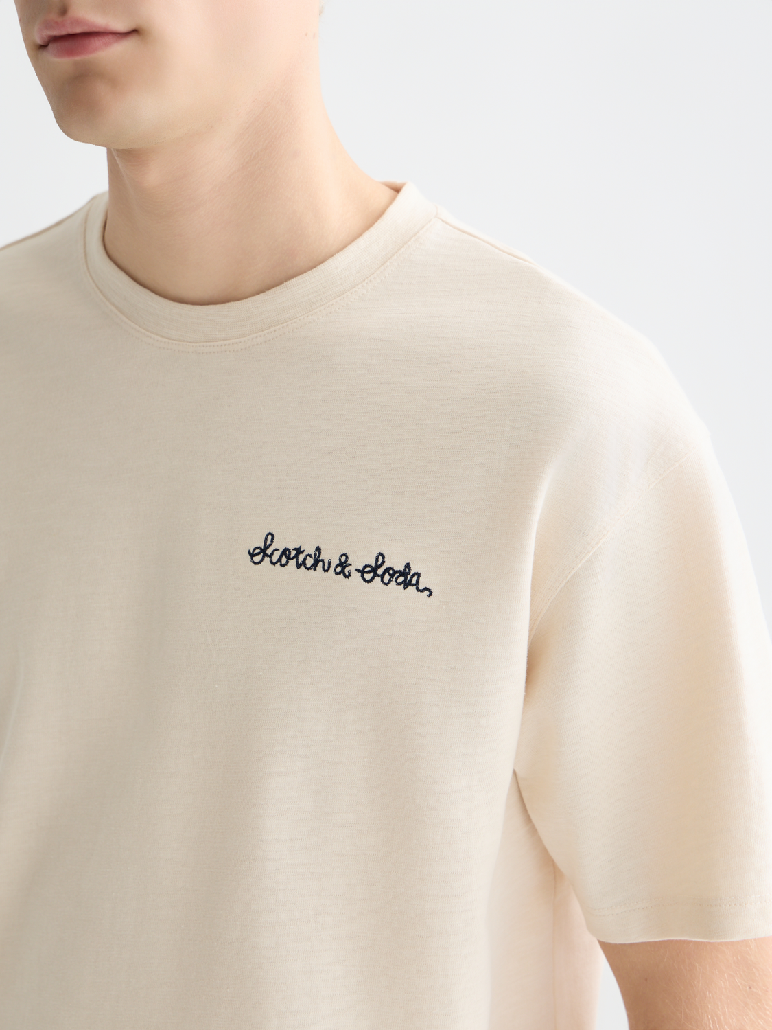 Short sleeve Scotch & Soda embroidered logo t-shirt with a colorful design and casual fit.