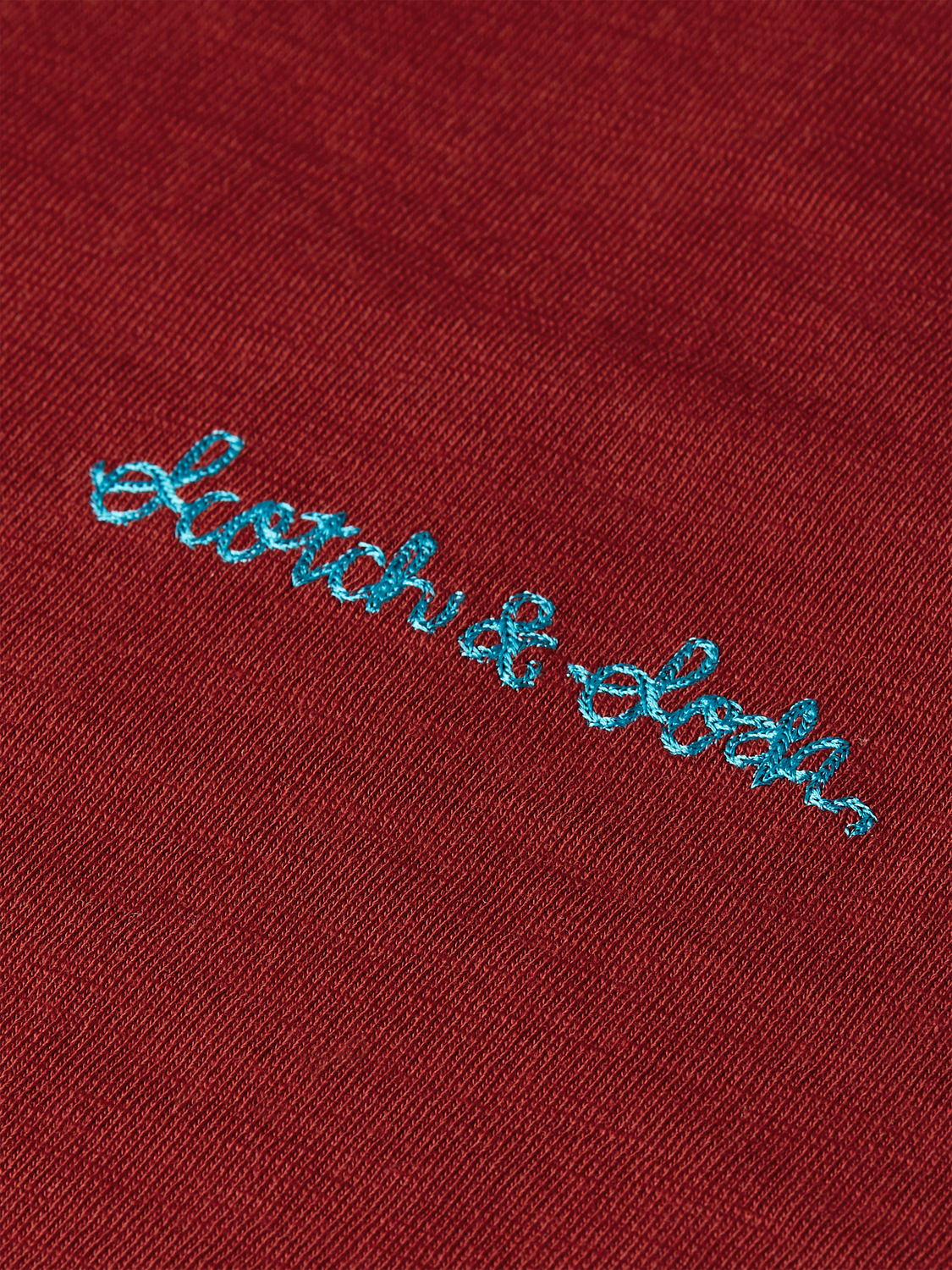 White short-sleeve T-shirt by Scotch & Soda with embroidered logo detail on the chest.
