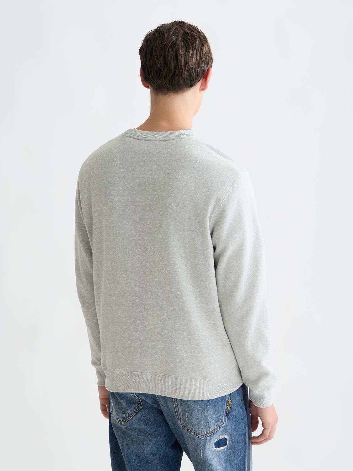 Scotch & Soda Melange sweatshirt featuring a cozy, textured knit fabric with a relaxed fit and ribbed cuffs and hem.