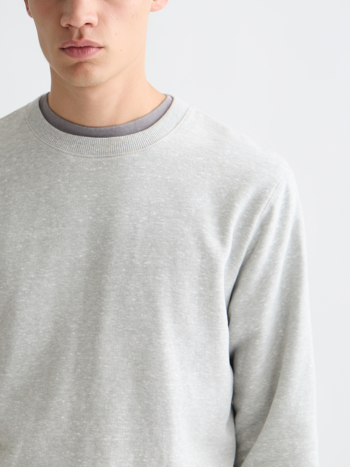 Scotch & Soda melange sweatshirt with a cozy knit texture, featuring a relaxed fit and ribbed cuffs and hem.