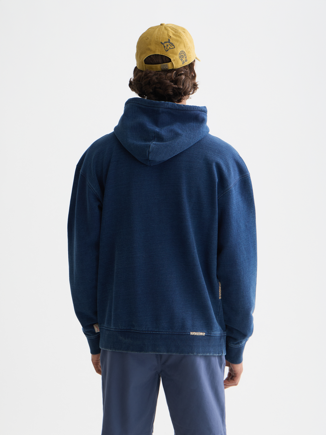 Indigo hoodie from Scotch & Soda, soft cotton sweat with a relaxed fit and ribbed cuffs, shown from the back view.