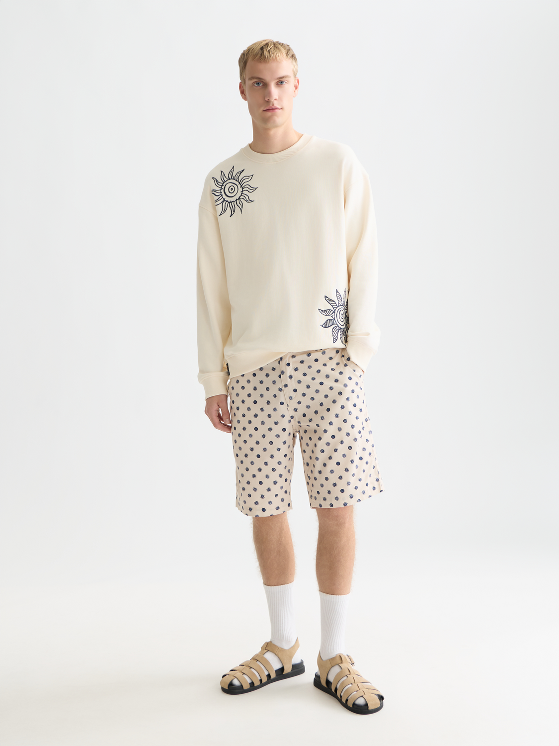 Embroidered SCOTCH & SODA sweatshirt with detailed embroidery on soft gray sweat fabric, front view.