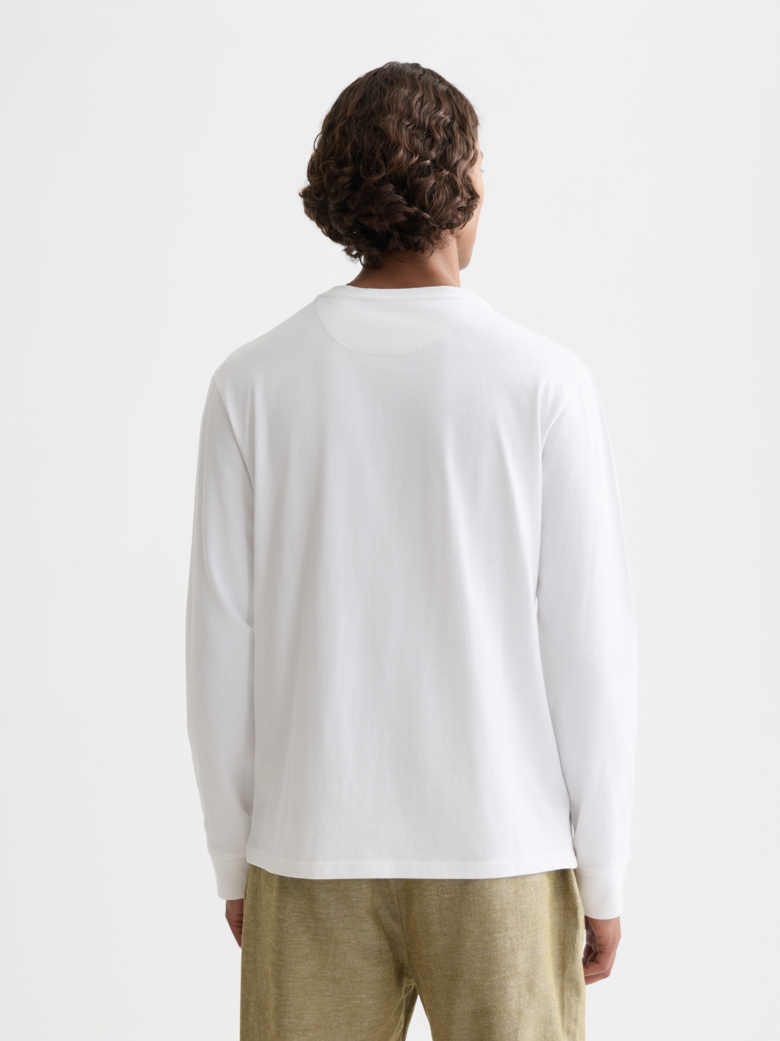 Black Scotch & SODA logo long-sleeved T-shirt with front print, casual fit, and soft fabric, shown on a hanger.
