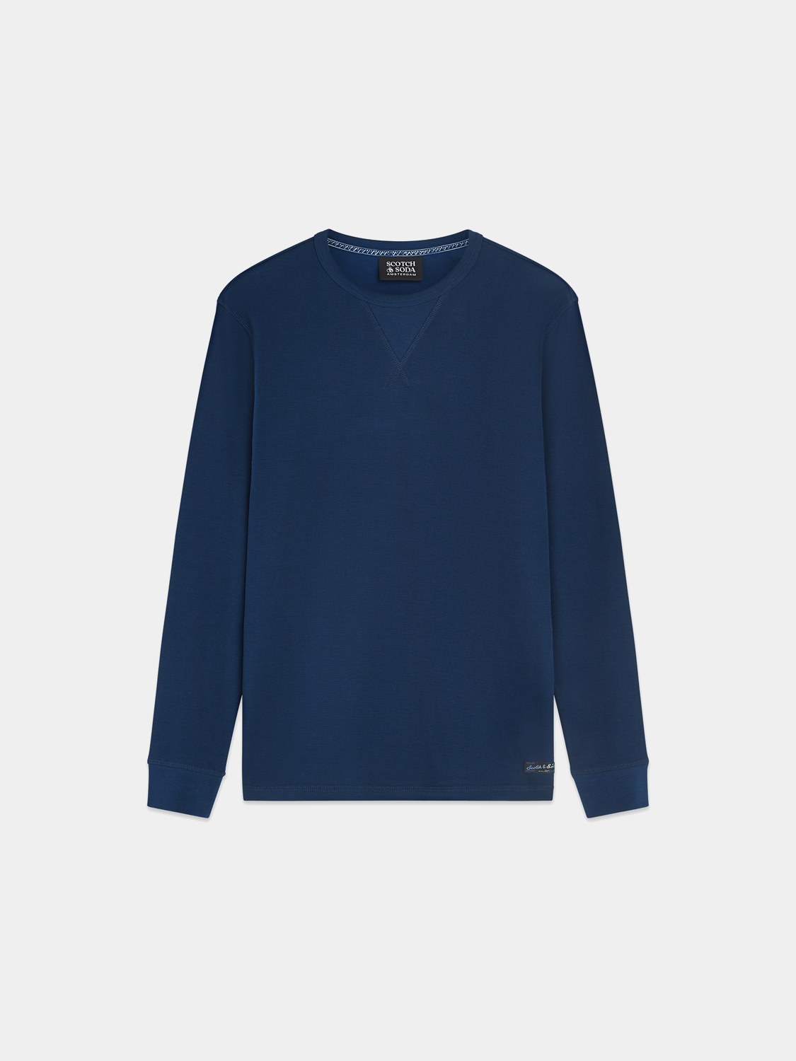 Long-sleeved waffle T-shirt by Scotch & Soda, beige color, with a relaxed fit and textured fabric.
