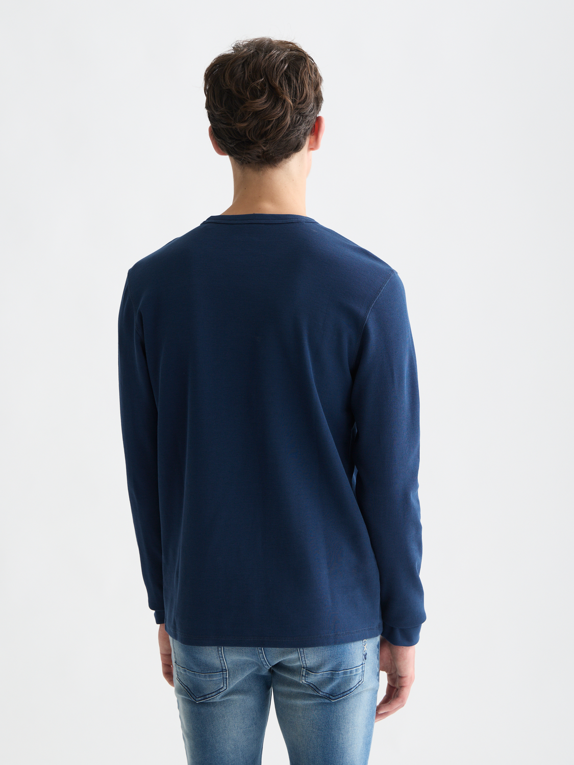 Long-sleeved waffle T-shirt by Scotch & Soda featuring a textured fabric and classic fit, shown from the back.