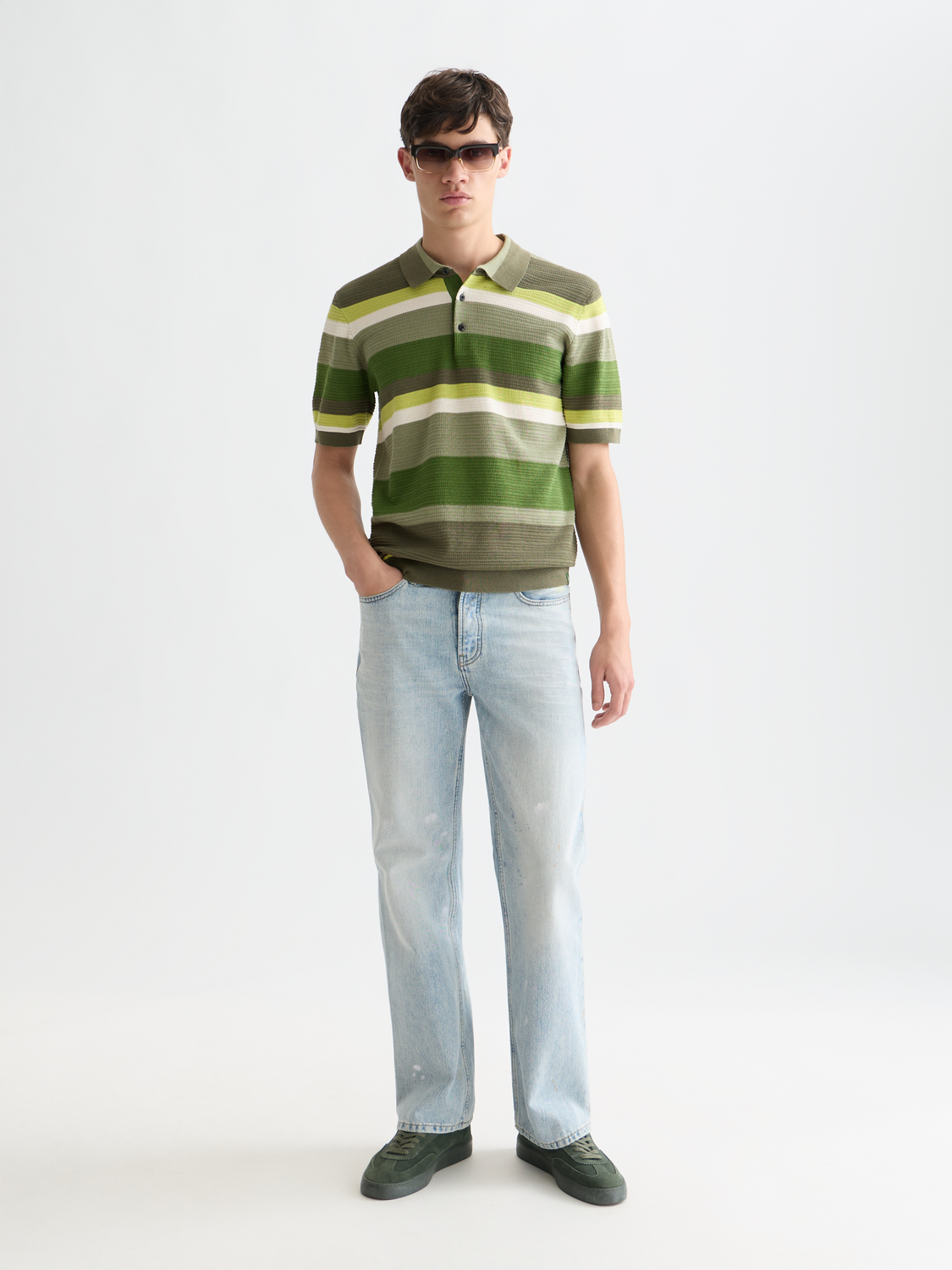 Scotch & Soda wide-fit denim jeans with a classic five-pocket design and light wash, displayed on a neutral background.