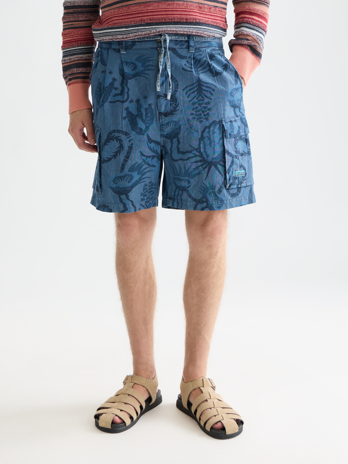 Men's denim cargo shorts by Scotch & Soda with printed design, featuring multiple pockets and a casual fit.