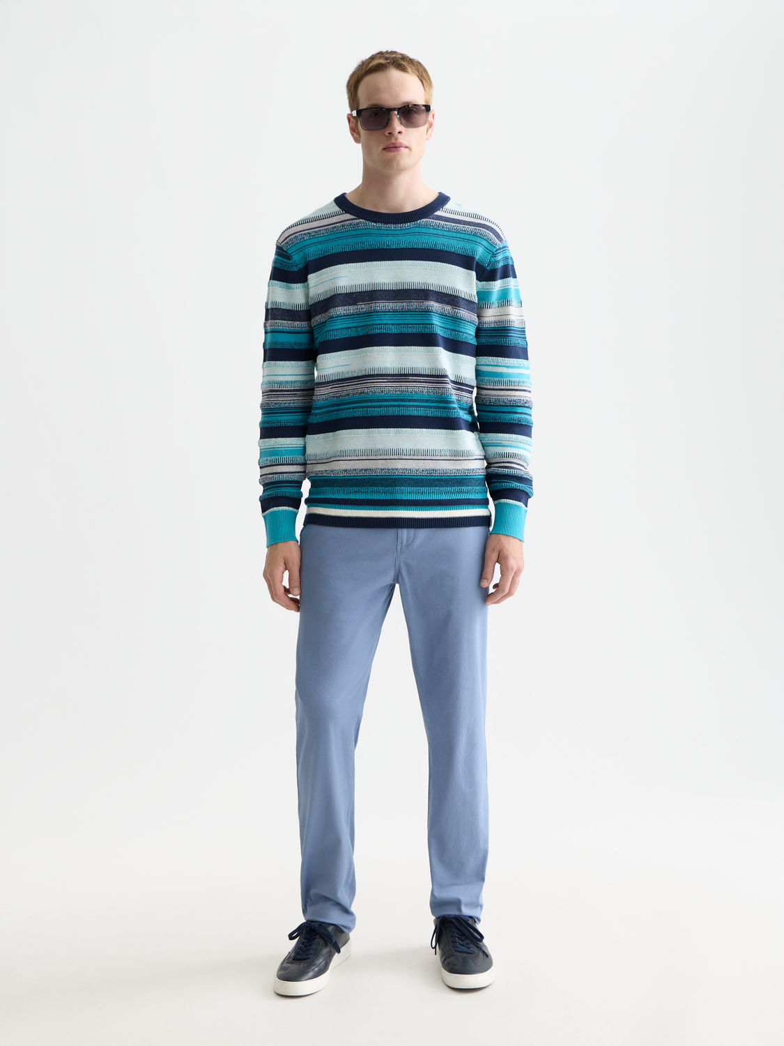 Scotch & Soda Stuart slim-fit chinos pants in khaki color, showing a close-up of the fabric and front design.