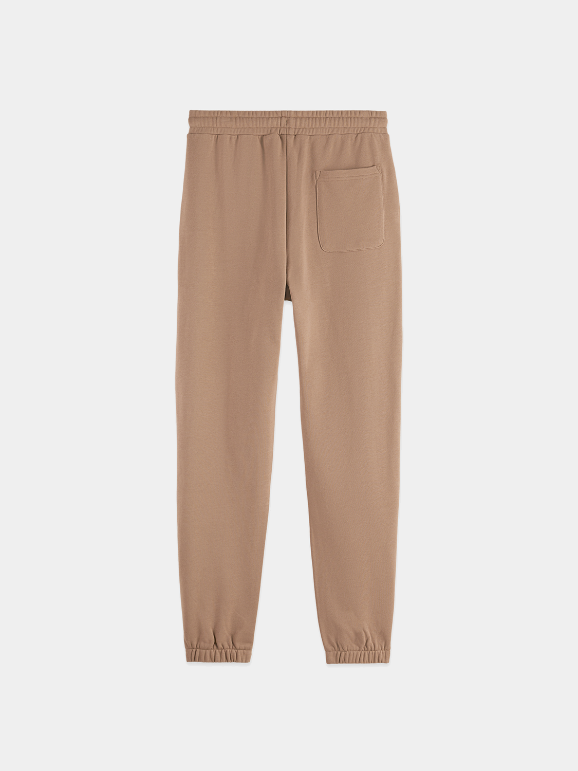 Black sweatpants with logo badge from Scotch & Soda, featuring a relaxed fit and casual style.