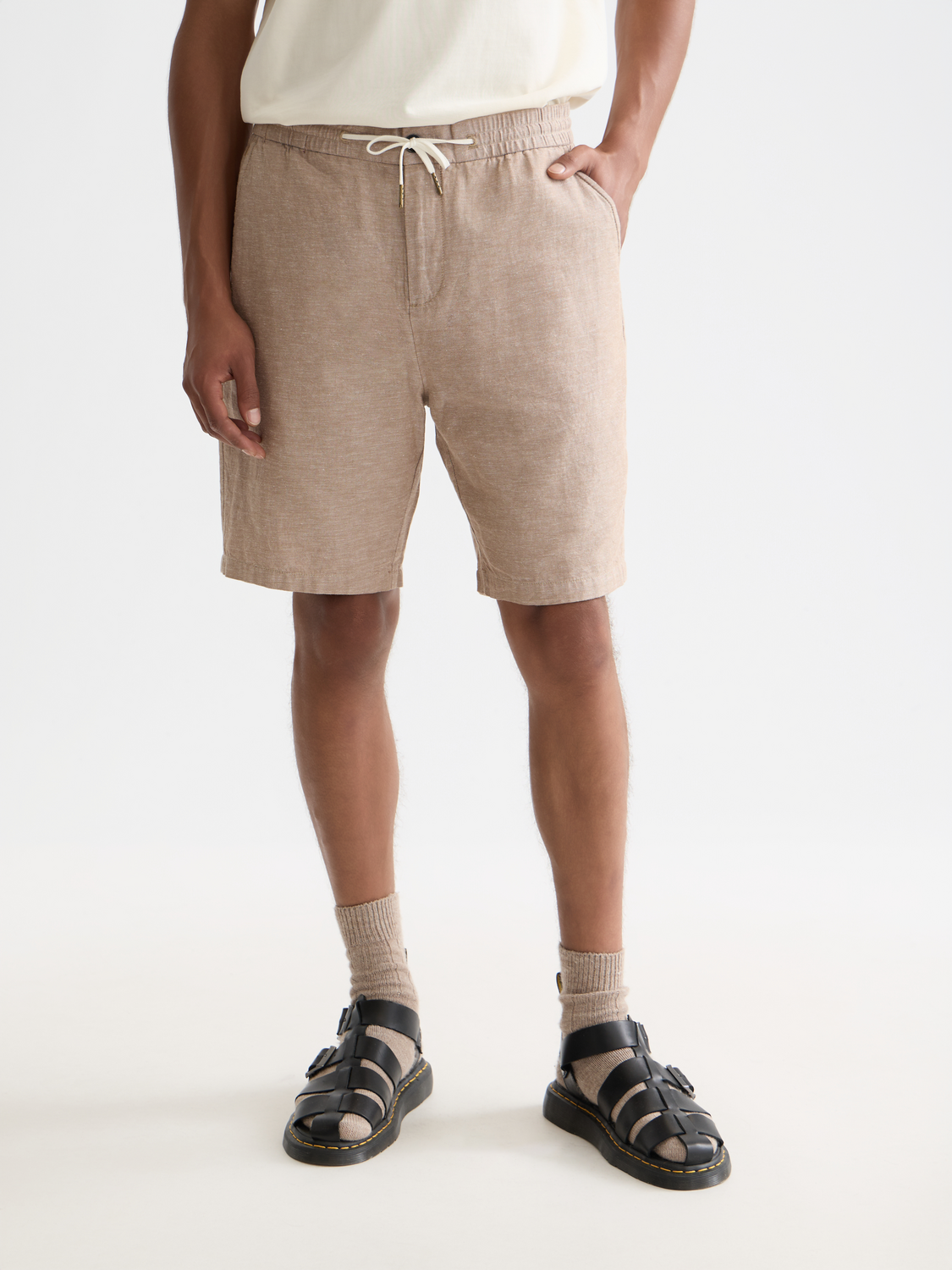 Light beige Fave cotton-linen shorts by Scotch & Soda displayed on a model, featuring a relaxed fit and casual style.