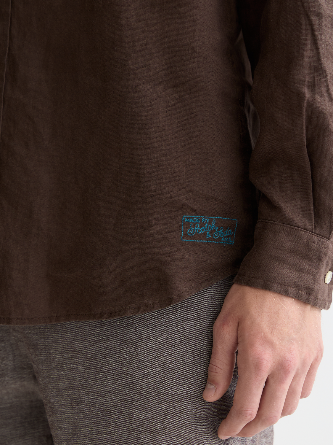Long-sleeve Scotch & Soda linen shirt with a relaxed fit, light fabric, and casual style, displayed on a hanger.