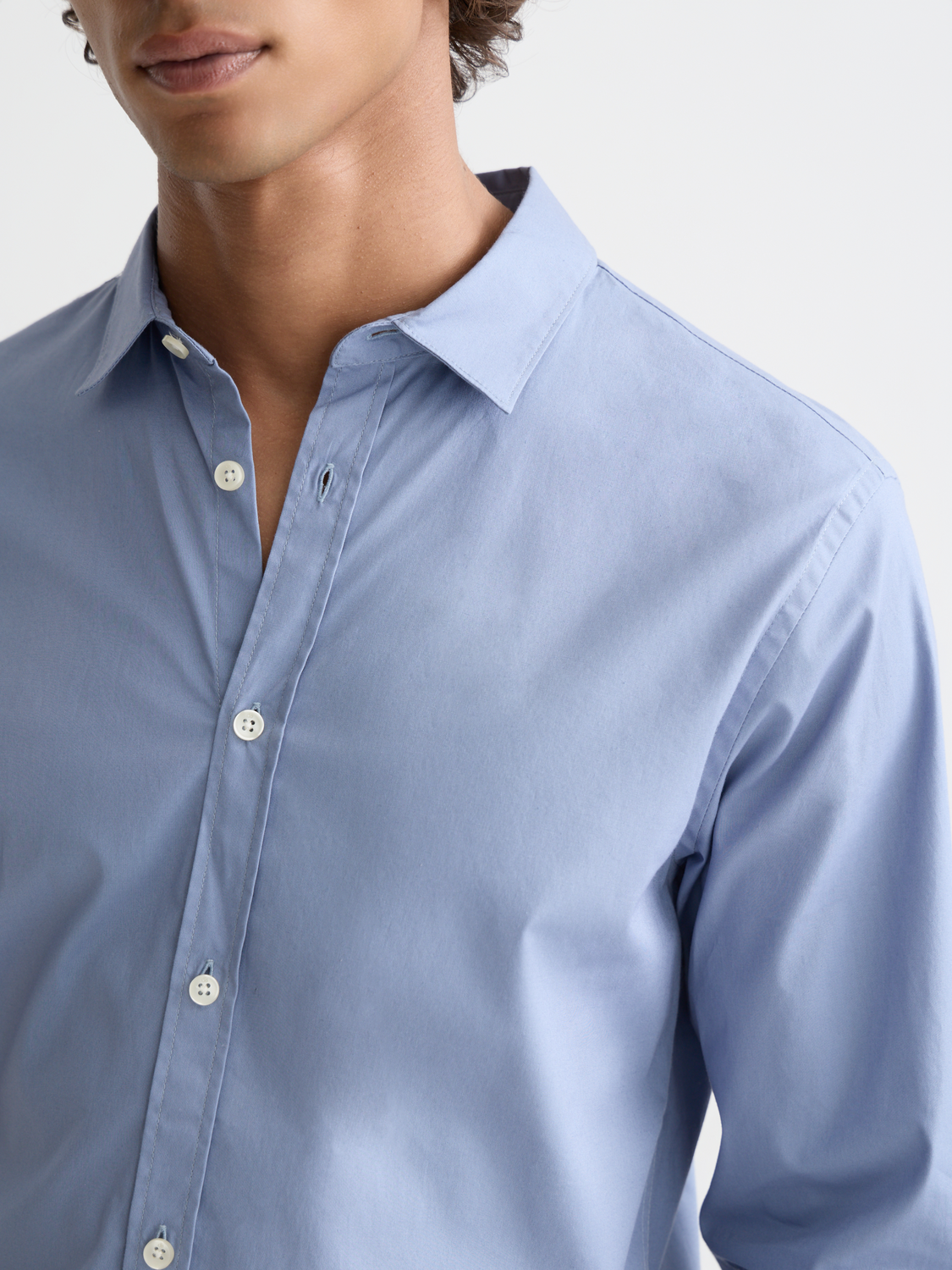Long sleeve Scotch & Soda poplin shirt with classic collar and button front, shown in a stylish casual fit.
