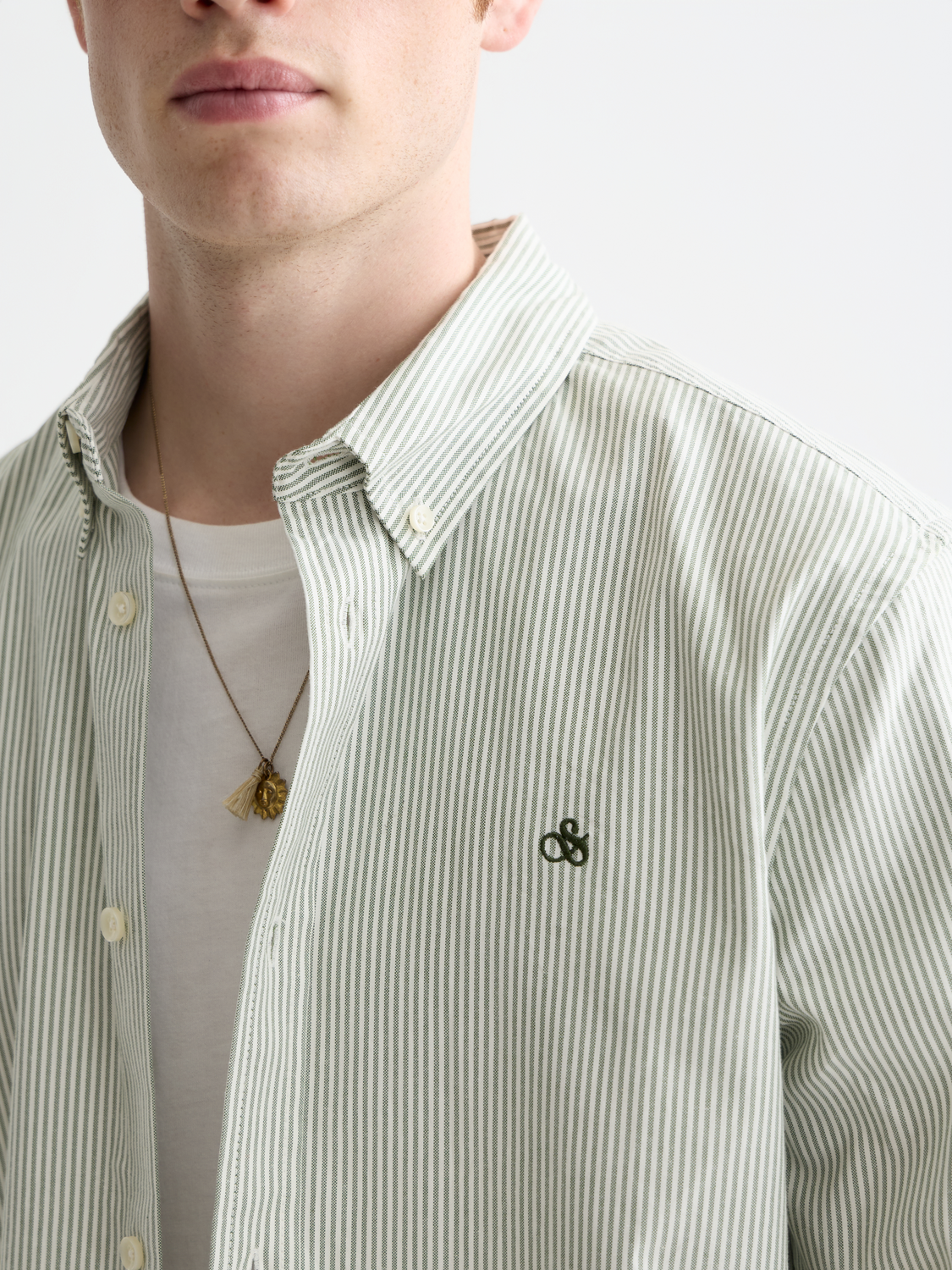 Navy and white striped Scotch & Soda long-sleeve Oxford shirt displayed on a hanger.