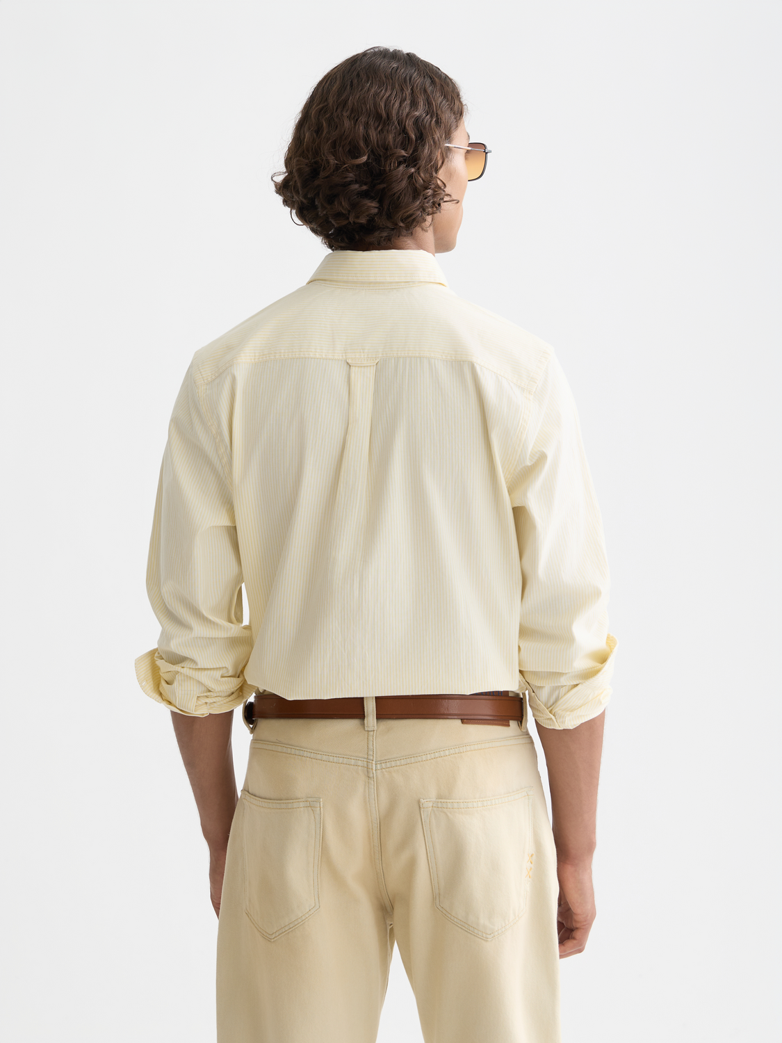 Navy and white striped Scotch & Soda long-sleeve Oxford shirt with button collar, shown from the back.