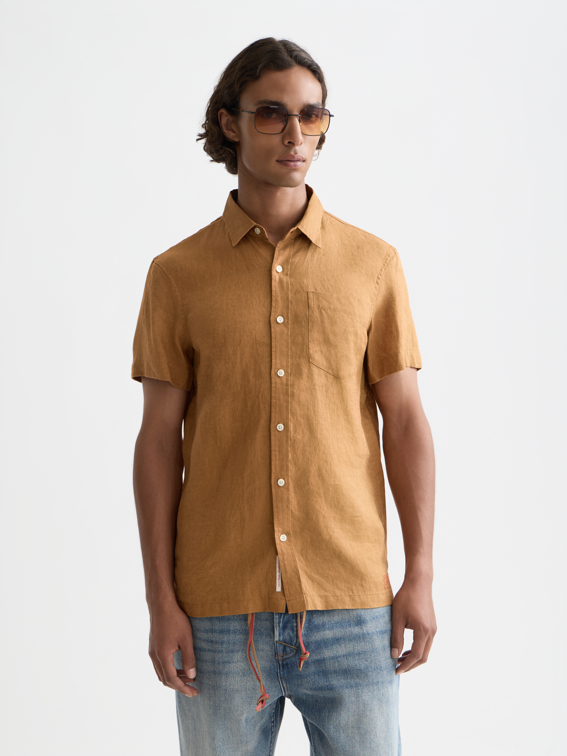 Short-sleeved linen shirt by Scotch & Soda, featuring a casual fit and lightweight fabric, shown in a front view.