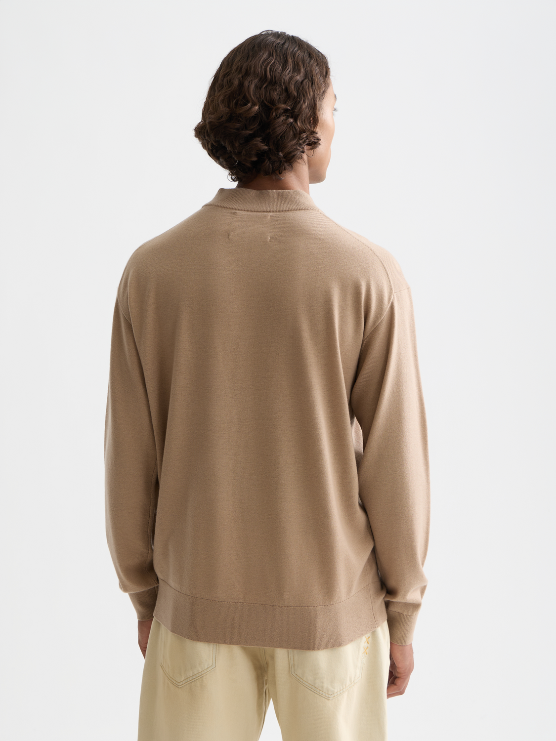 Scotch & Soda dropped shoulder mock neck knitwear in a soft, cozy fabric, shown from the back with a relaxed fit.