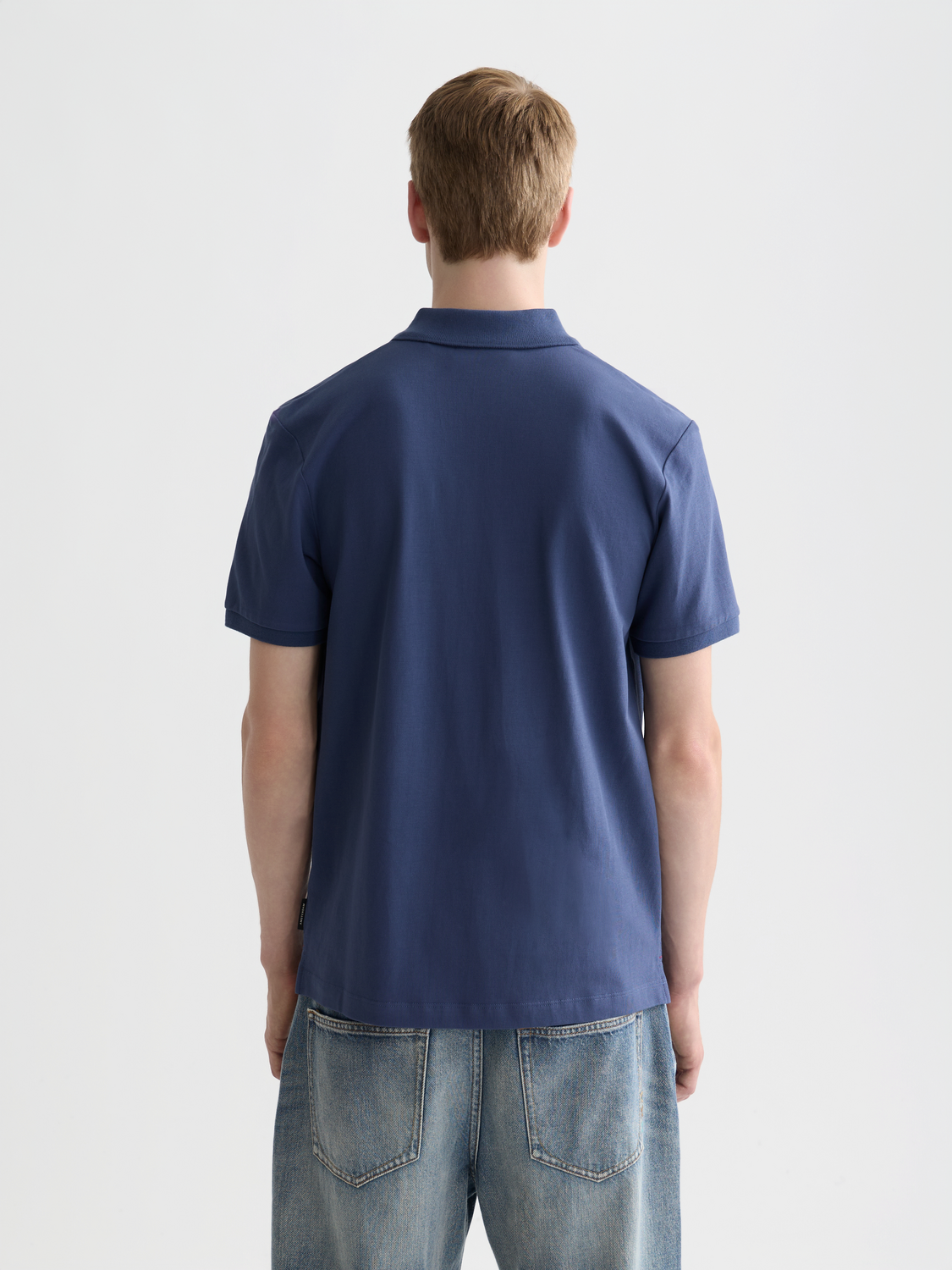 SCOTCH & SODA logo pique polo shirt in navy with collar and short sleeves, displayed flat.