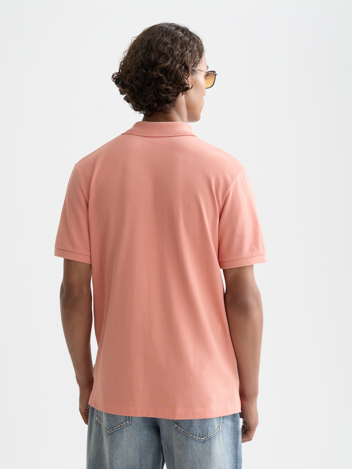 Navy Scotch & Soda logo pique polo shirt with a classic collar and short sleeves, displayed flat on a white background.