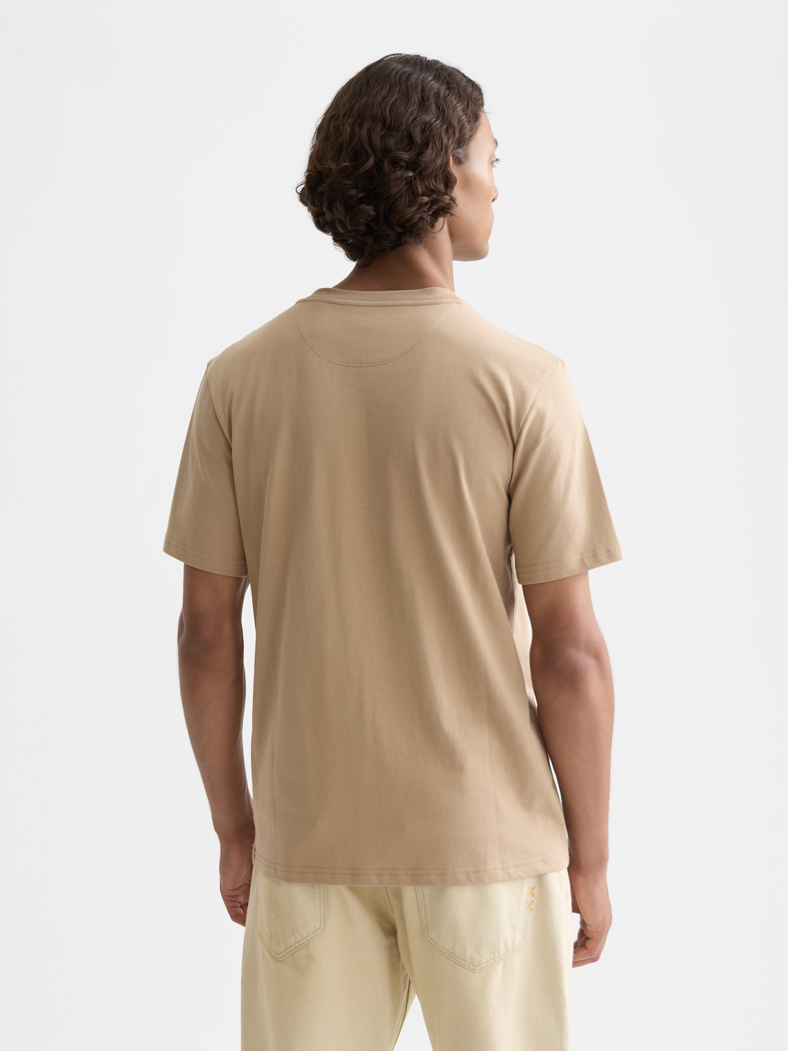 Black short-sleeve Scotch & Soda logo t-shirt with a printed front design on a mannequin.