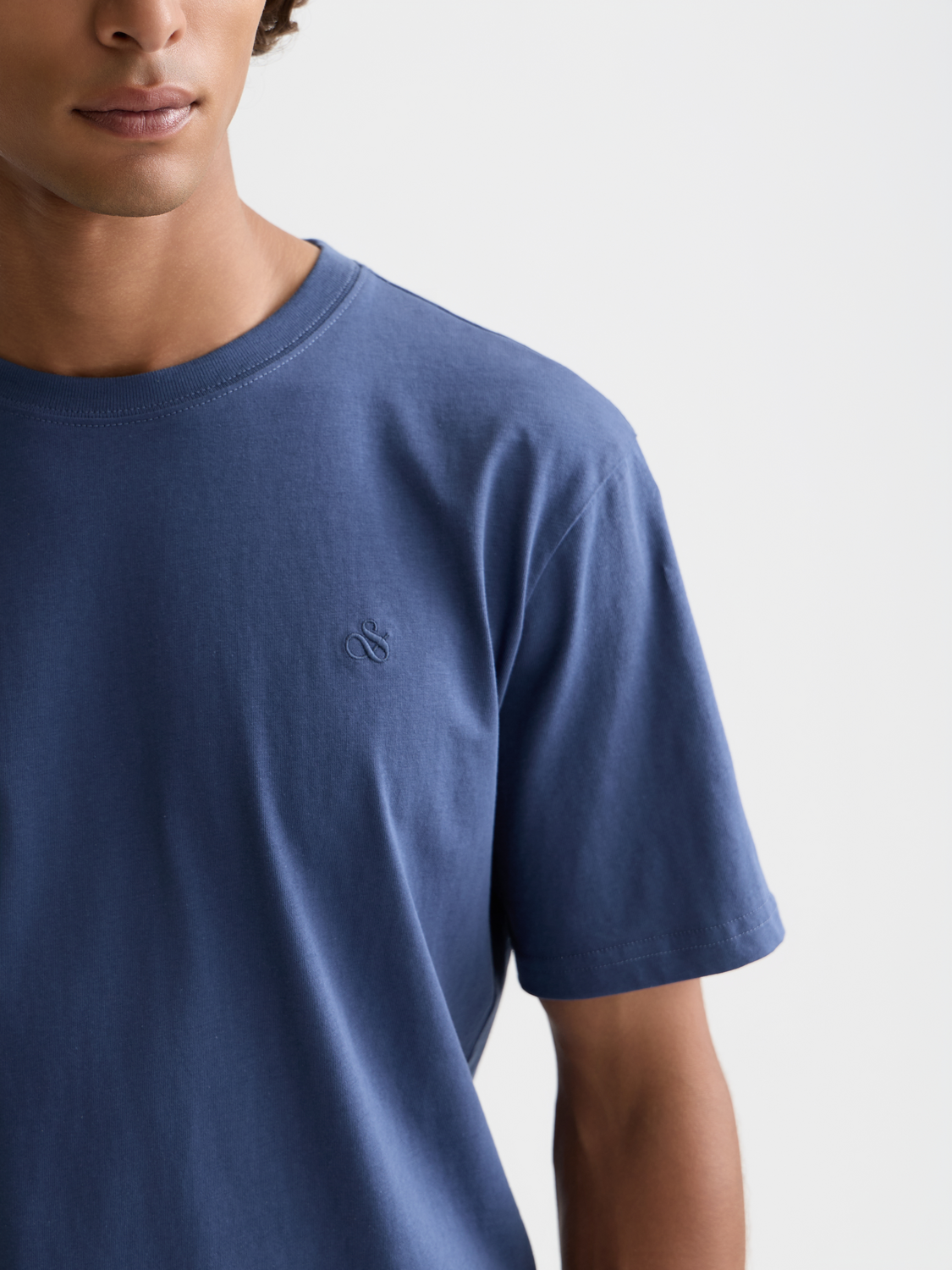 White short sleeve T-shirt with Scotch & Soda logo print on front, casual men's logo tee for everyday wear.