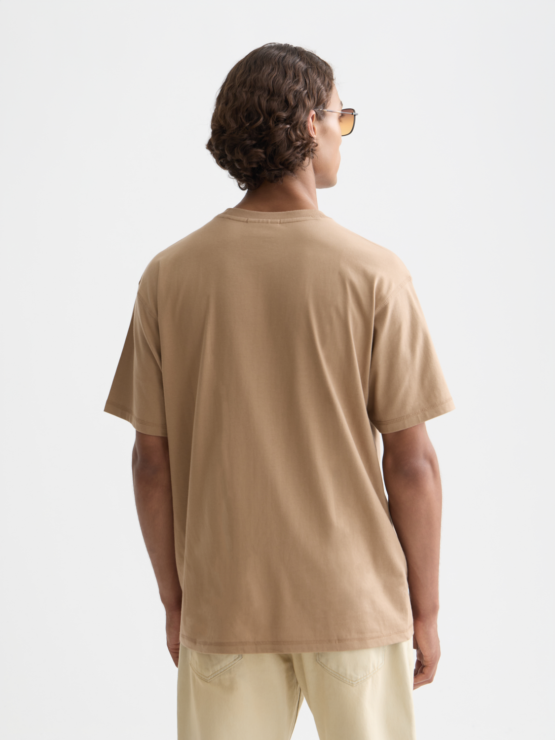 Black short sleeve Scotch & Soda logo t-shirt with front graphic design, casual fit, and soft fabric.
