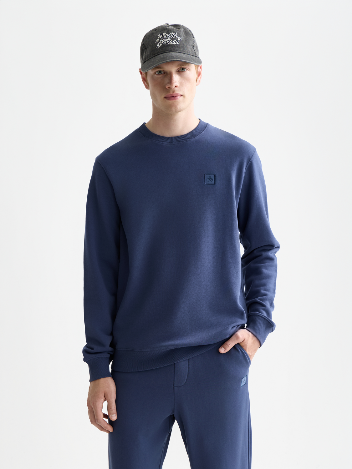 Scotch & Soda logo sweatshirt featuring a casual fit and soft fabric, displayed on a hanger with a plain background.