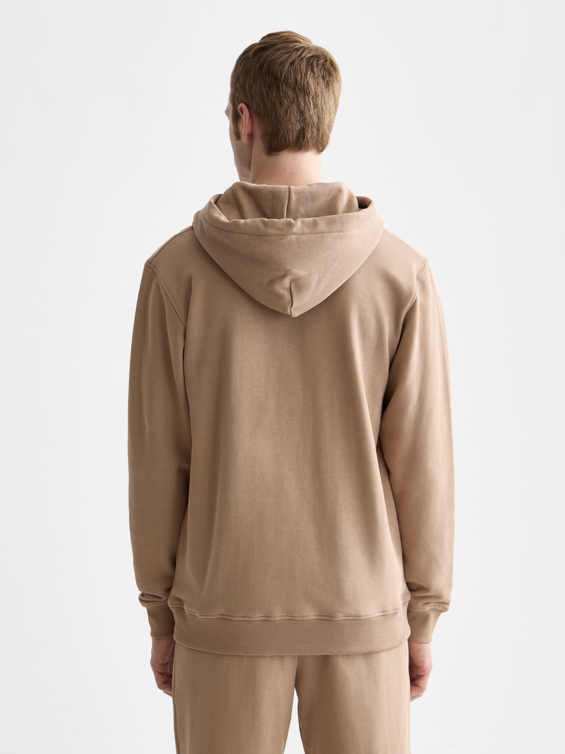 Black logo hoodie from Scotch & Soda, cozy sweatshirt with brand logo on front, soft fabric, and relaxed fit.
